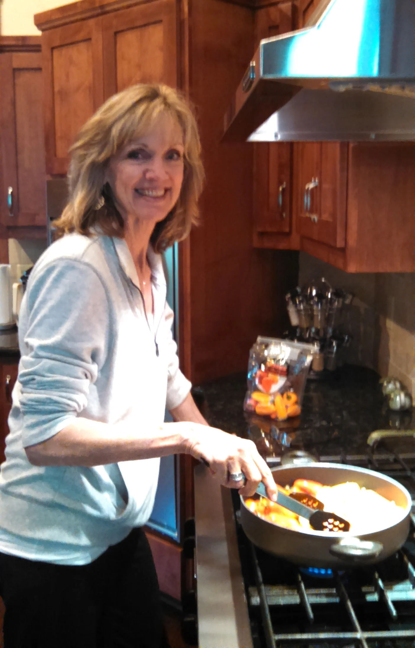 Hostess Sharon Kinney preparing mini peppers