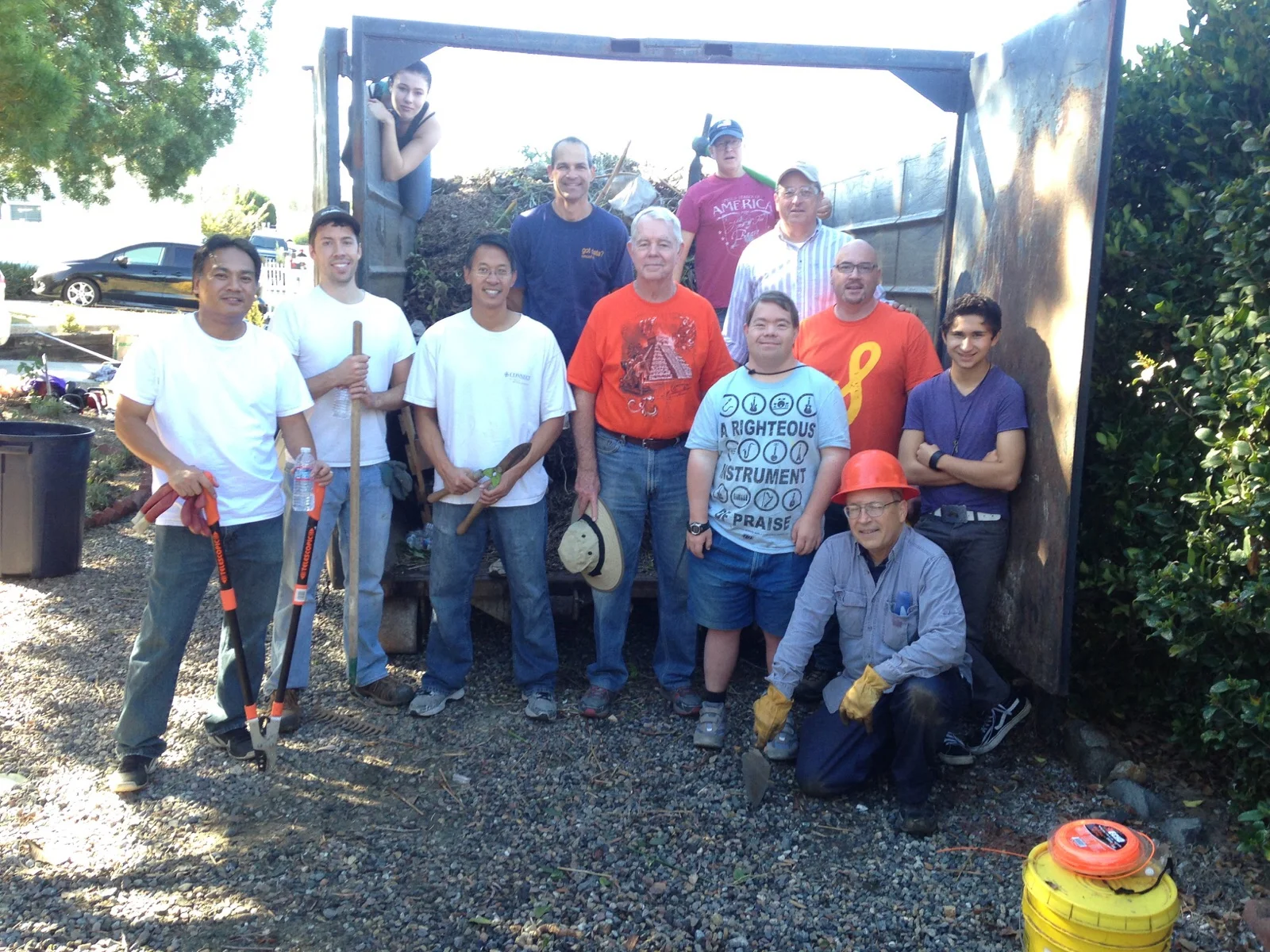 The team in front of the dumpster we filled!