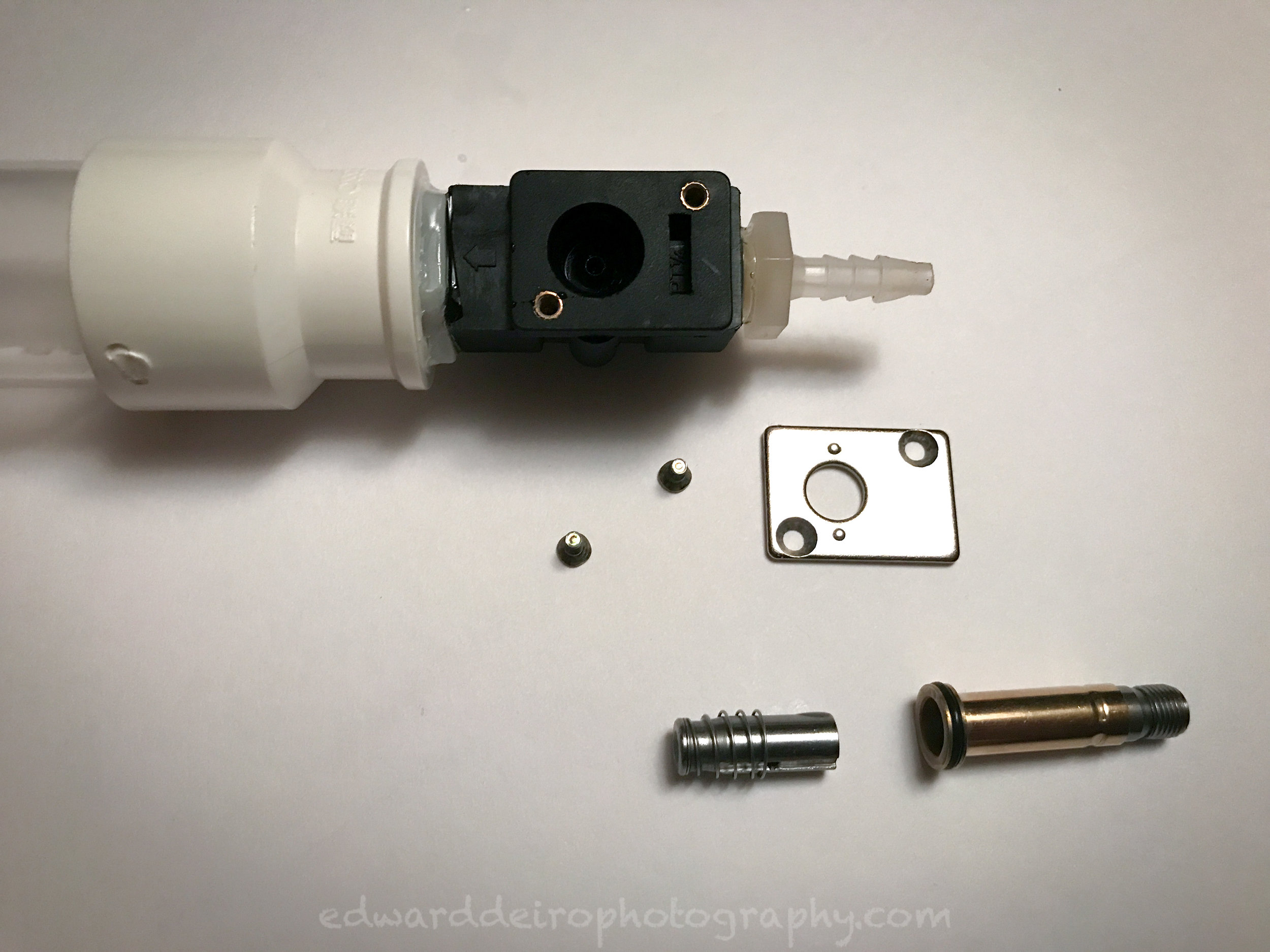 Completely disassembled. Note the oring on the brass tube of the plunger assembly.