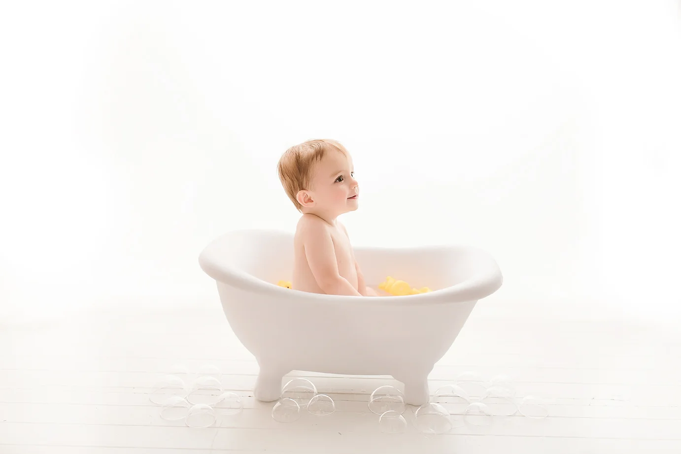 oc-baby-photographer-irvine-orange-county-bubble-bath-tub-bubbles-white.jpg
