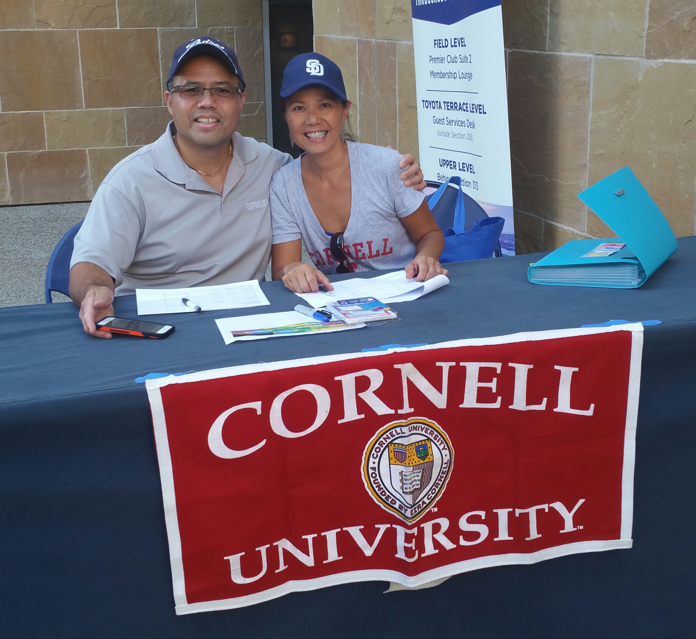 Norine & Mike Ready to Check in 100+ people for AJ's Speech.jpg