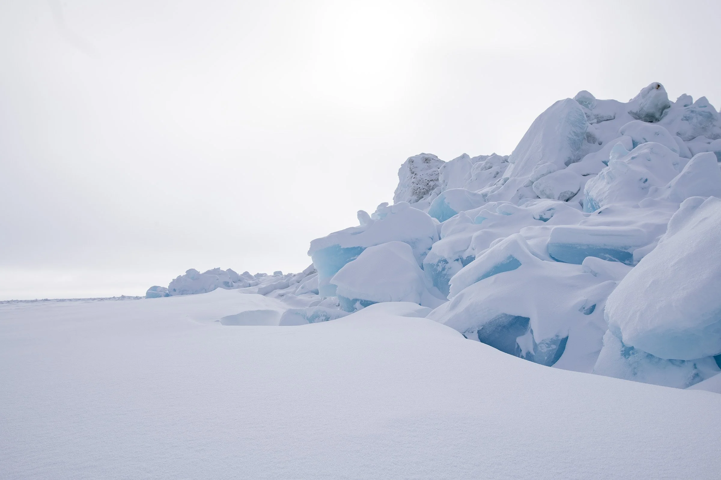 Sea ice pressure ridges are formed when flat areas of ice are driven into each other by wind and ocean currents.