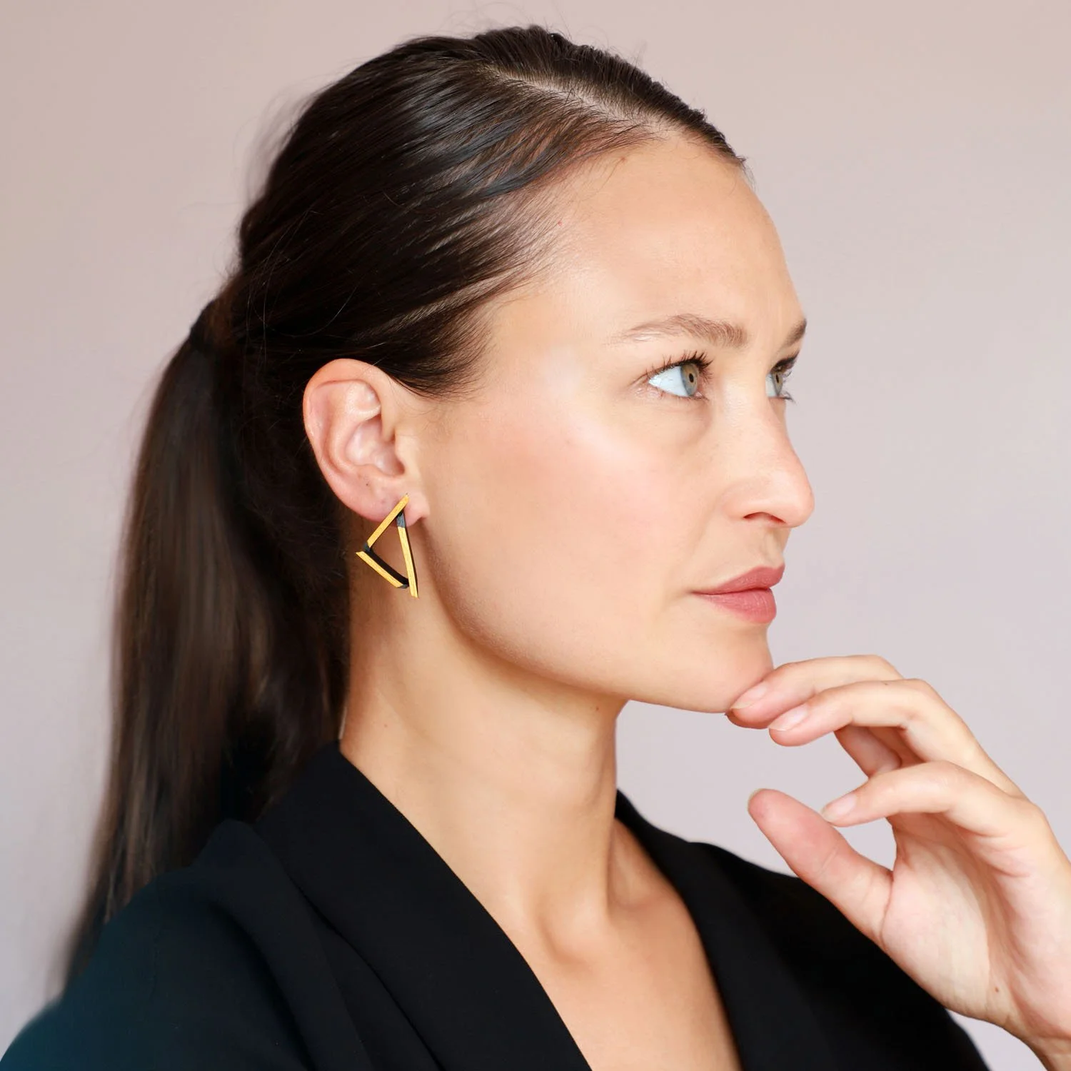 Triangle-leather-earrings-black-gold-Tania-Clarke-Hall-modelled.jpg