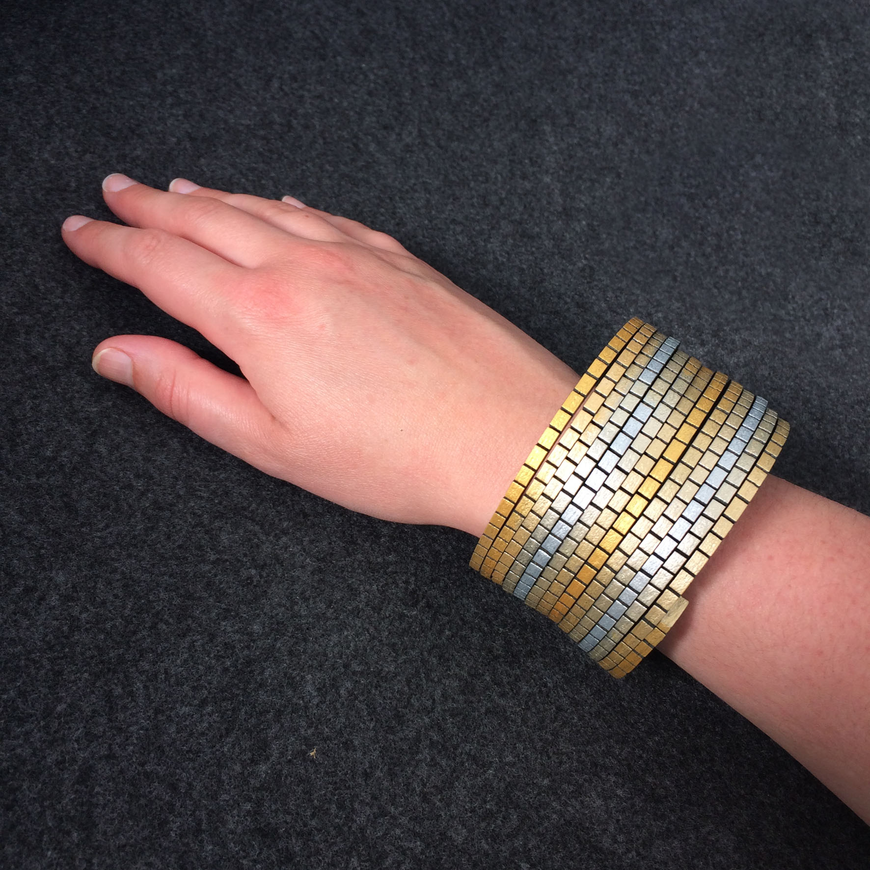 Wound Up Bracelet - Black & Gold-Silver -  modelled.jpg