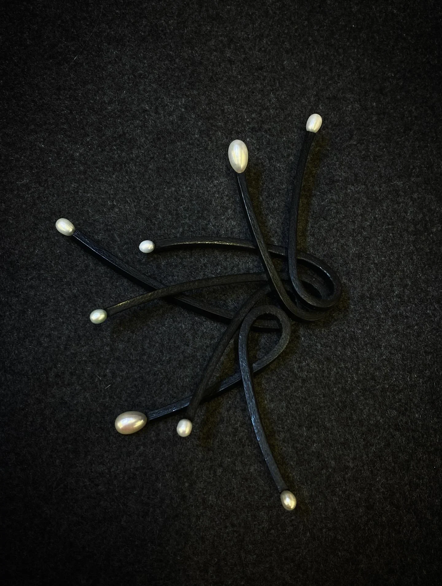 &lsquo;Knot a Pearl&rsquo; brooch with teardrop freshwater pearls ready for @morganjewellery 10th birthday show. 

The polished edges of the leather catch the light even on dark surfaces and the bright pearls pop. 

#brooch #leatherbrooch #leatherand
