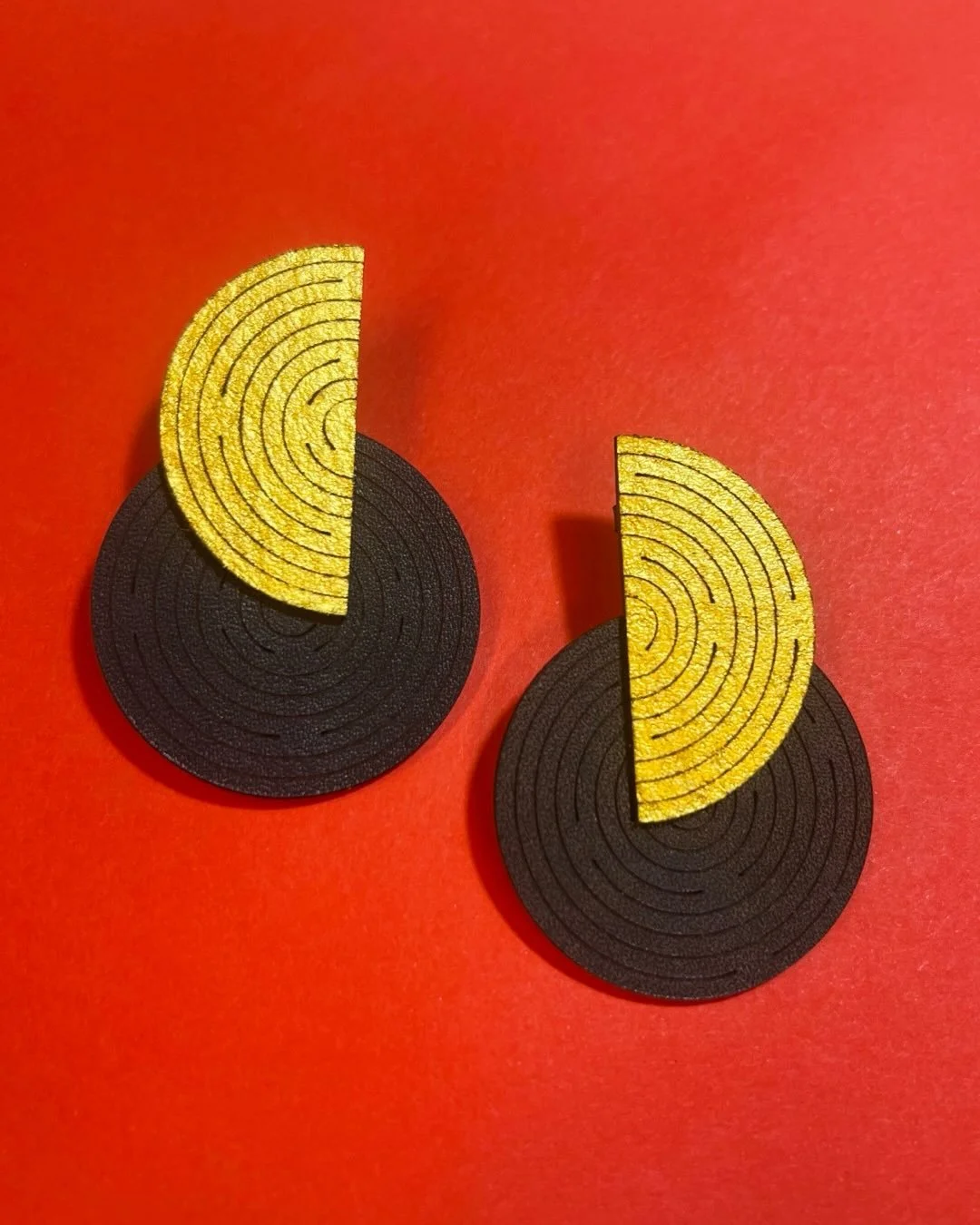 Special request from a special client!

Art Deco earrings in black &amp; gold. Not as 3D as much of my work, but I love their large scale and how they elegantly sit just beneath the jawline. 
 
#leatherjewellery #contemporaryjewellery #artdecoinspire