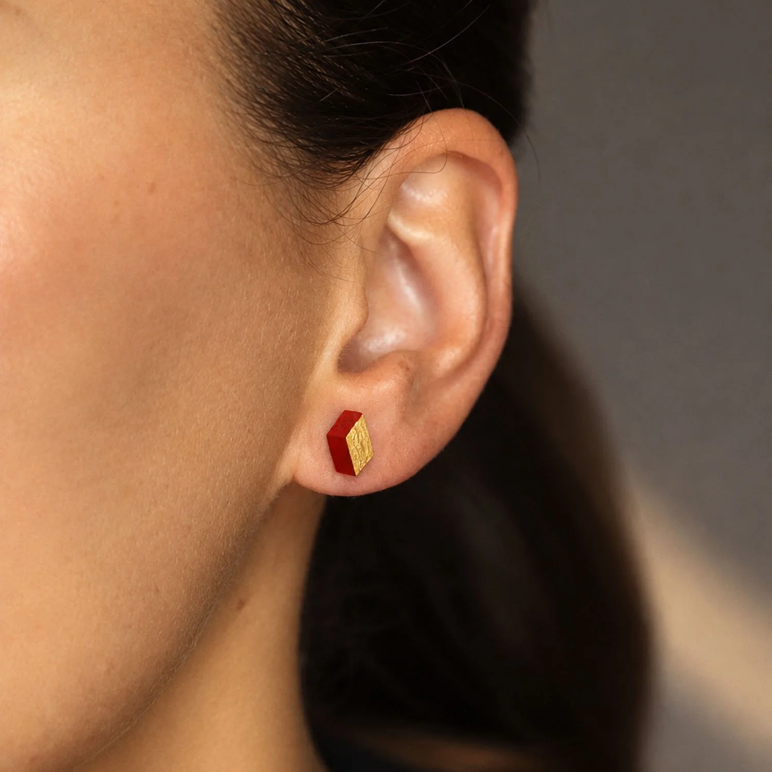 Diamond-leather-stud-earring-red-gold-Tania-Clarke-Hall-modelled-detail.jpg