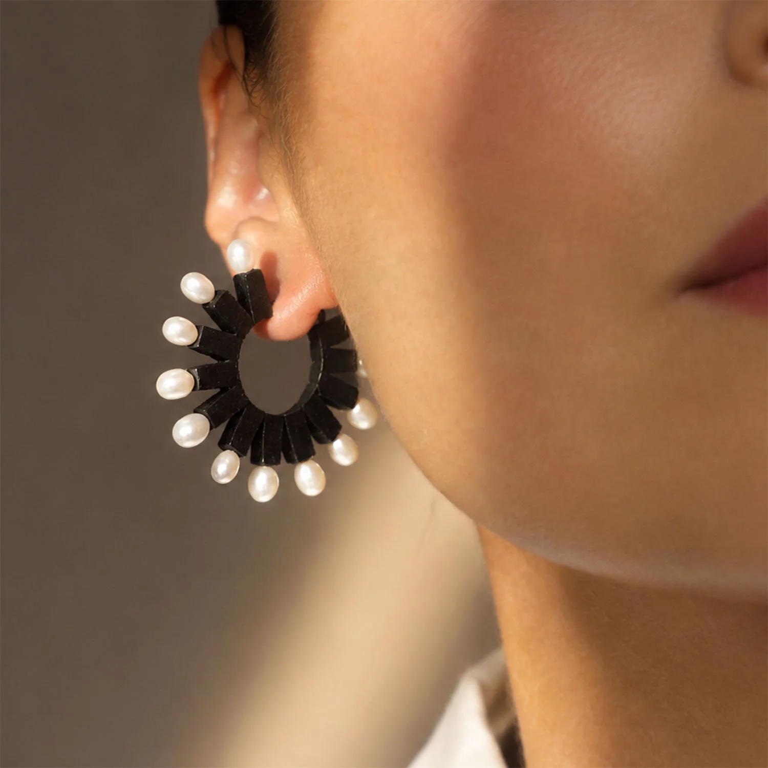 Pearl-loop-leather-statement-earring-black-Tania-Clarke-Hall-modelled-detail-front.jpg
