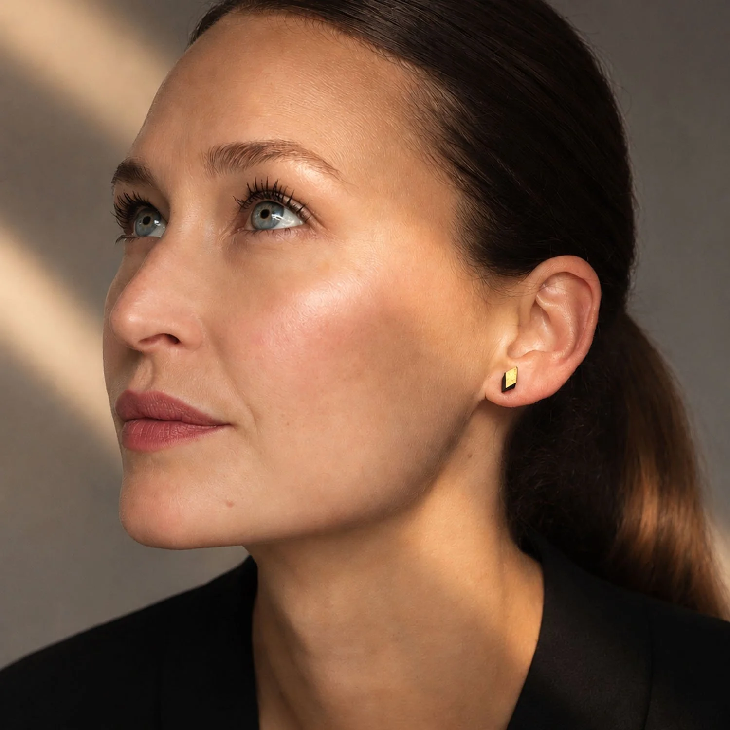 Diamond-leather-stud-earring-black-gold-Tania-Clarke-Hall-modelled.jpg