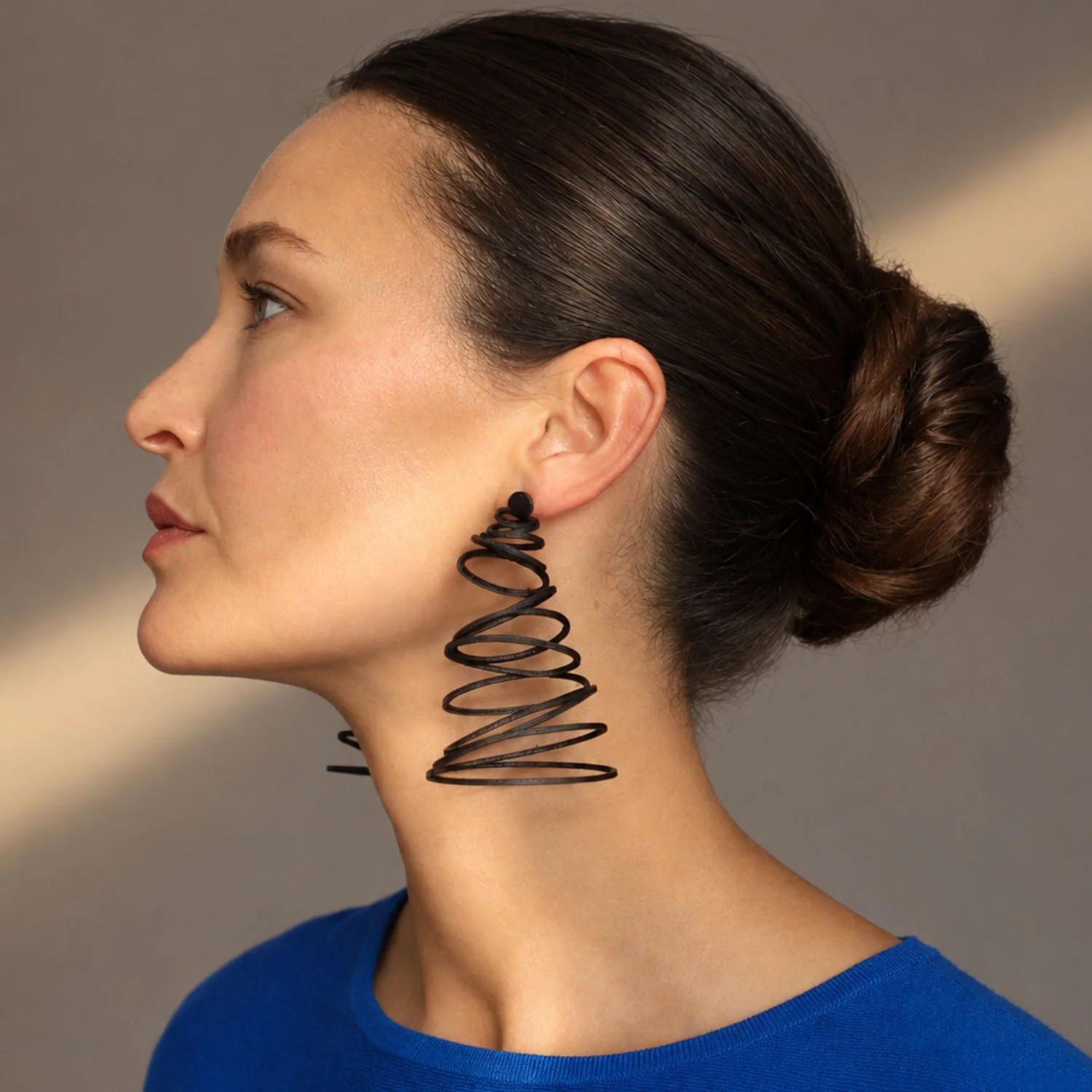 Falling-circles-leather-earrings-statement-black-Tania-Clarke-Hall.jpg