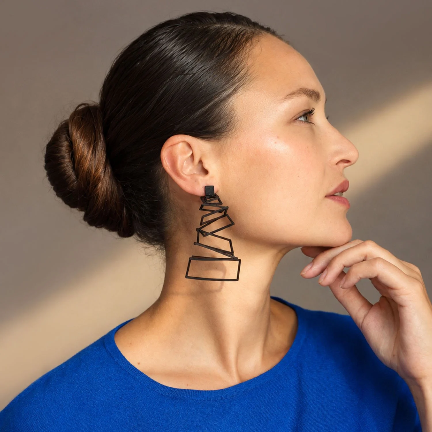 Falling-squares-leather-earrings-statement-black-Tania-Clarke-Hall-modelled2.jpg