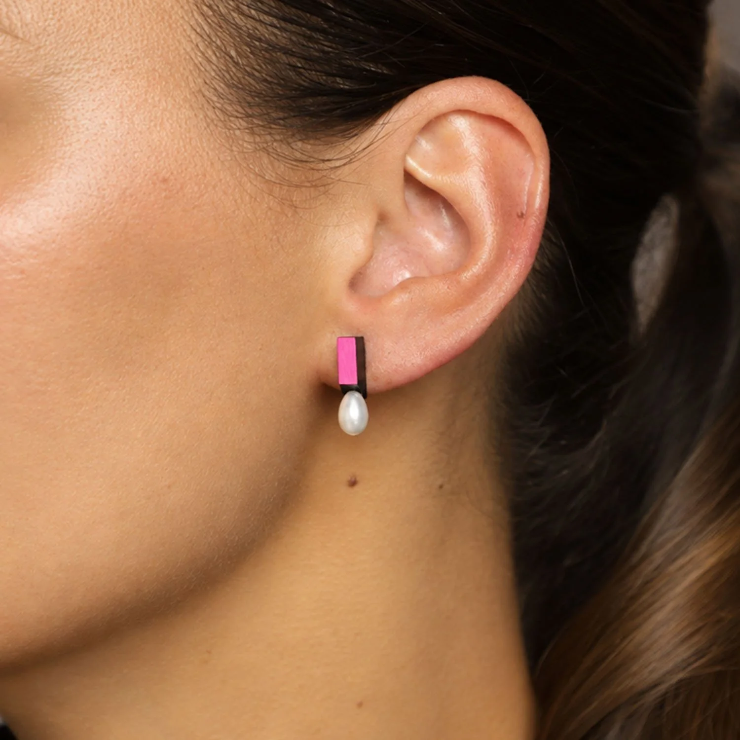 Medal-pearl-leather-stud-earring-black-pink-Tania-Clarke-Hall-modelled.jpg