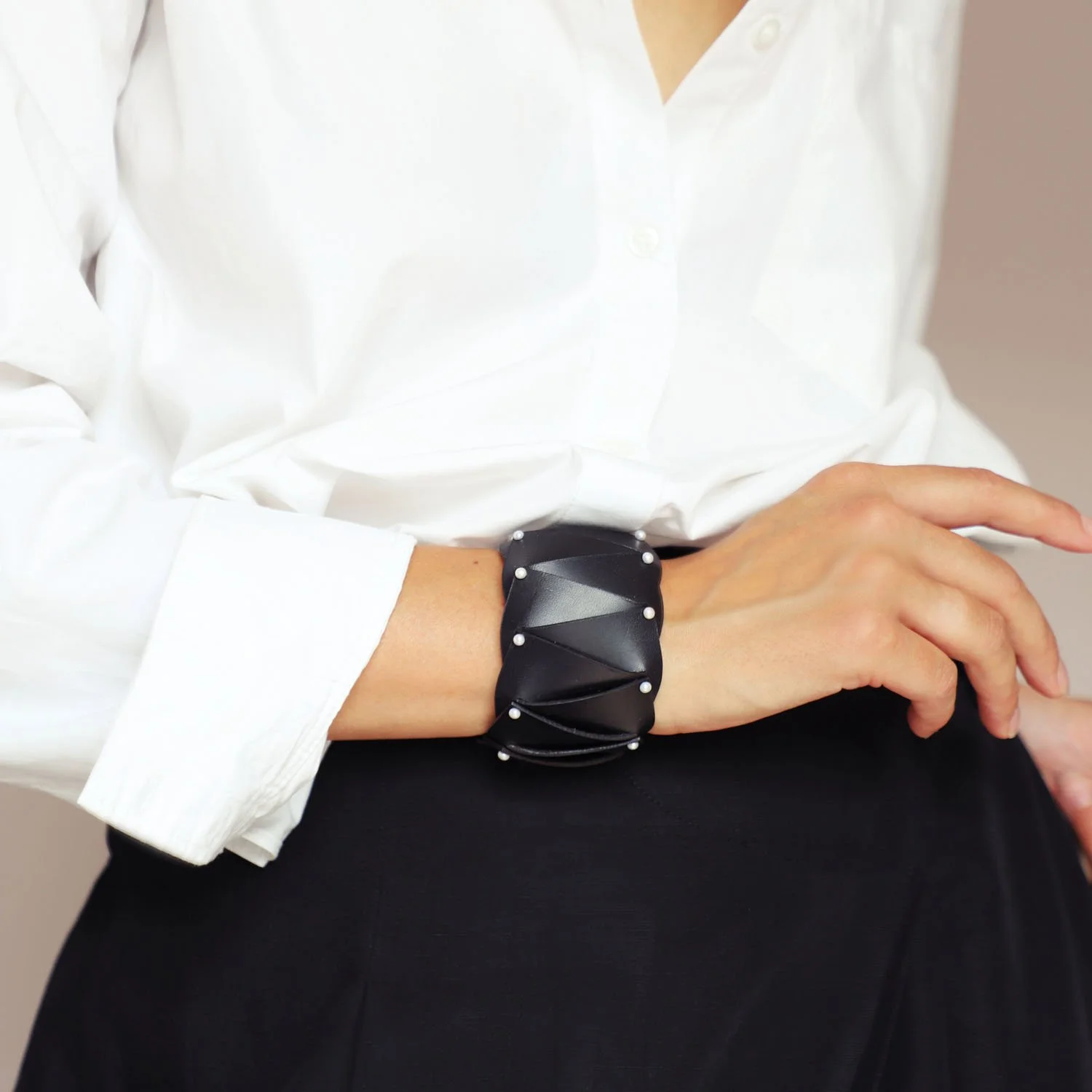 Cunard_pearl_leather_cuff_black_Tania_Clarke_Hall_modelled.jpg
