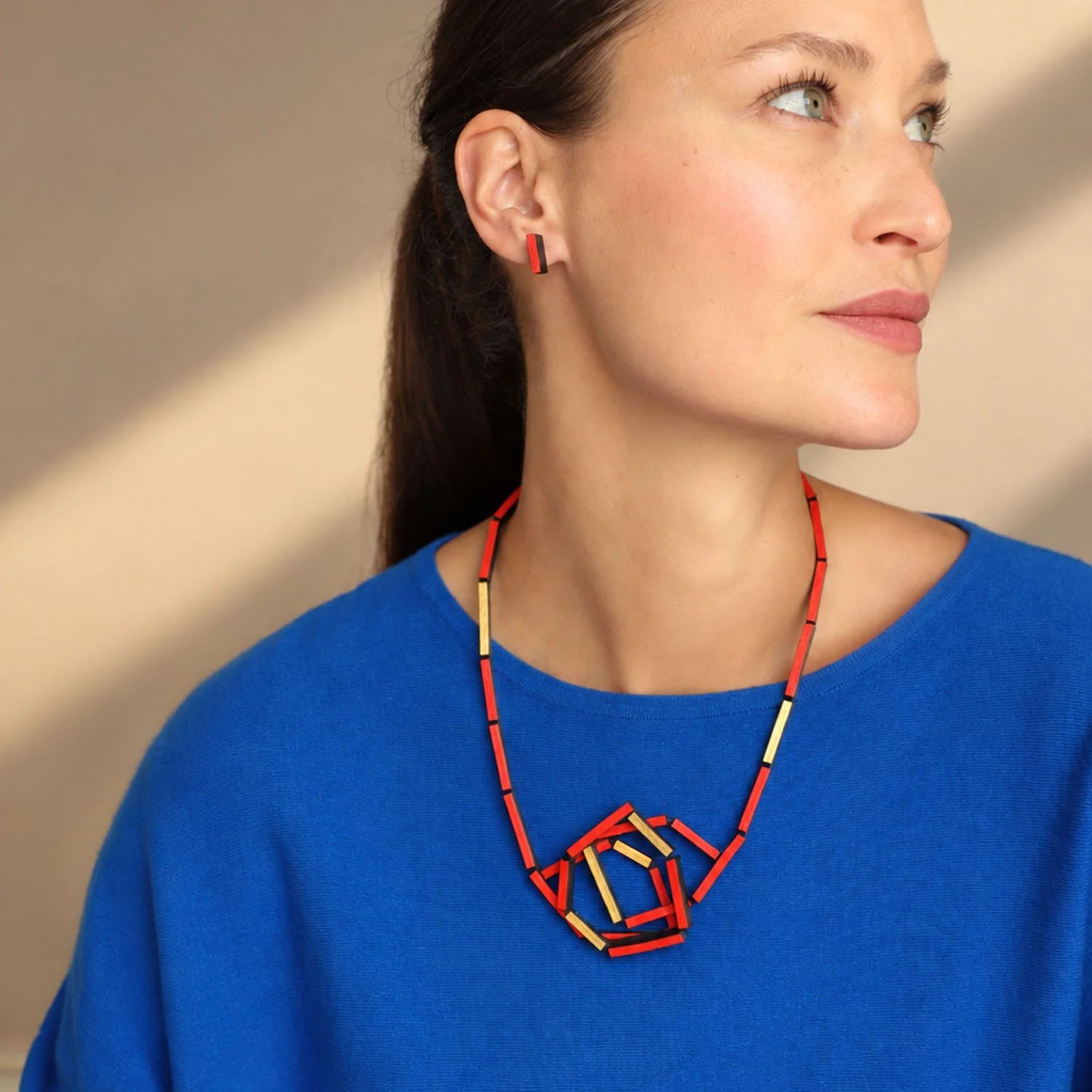 Knot-leather-necklace-red-gold-modelled-rectangular-red-studs copy.jpg