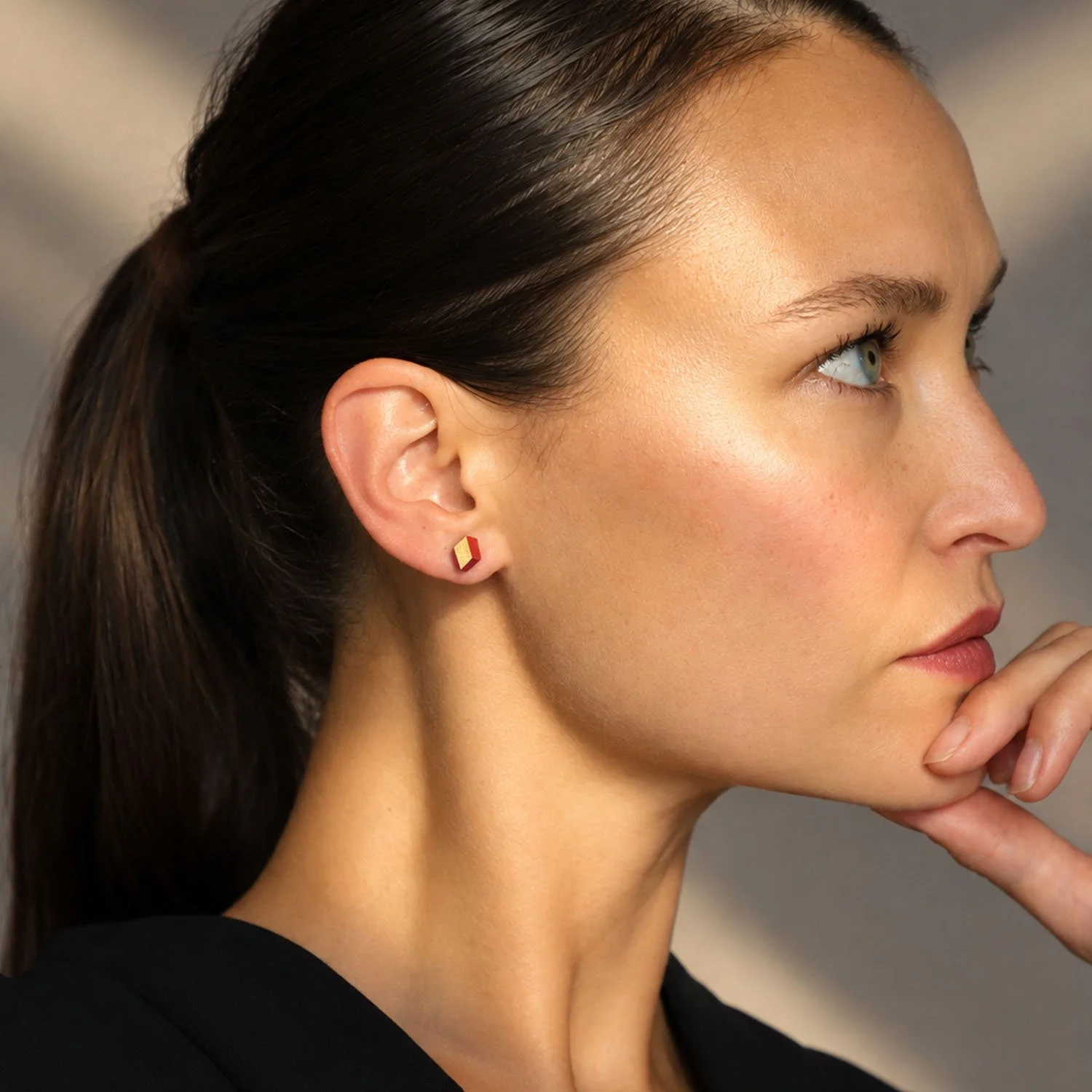 Diamond-leather-stud-earring-red-gold-Tania-Clarke-Hall-modelled.jpg