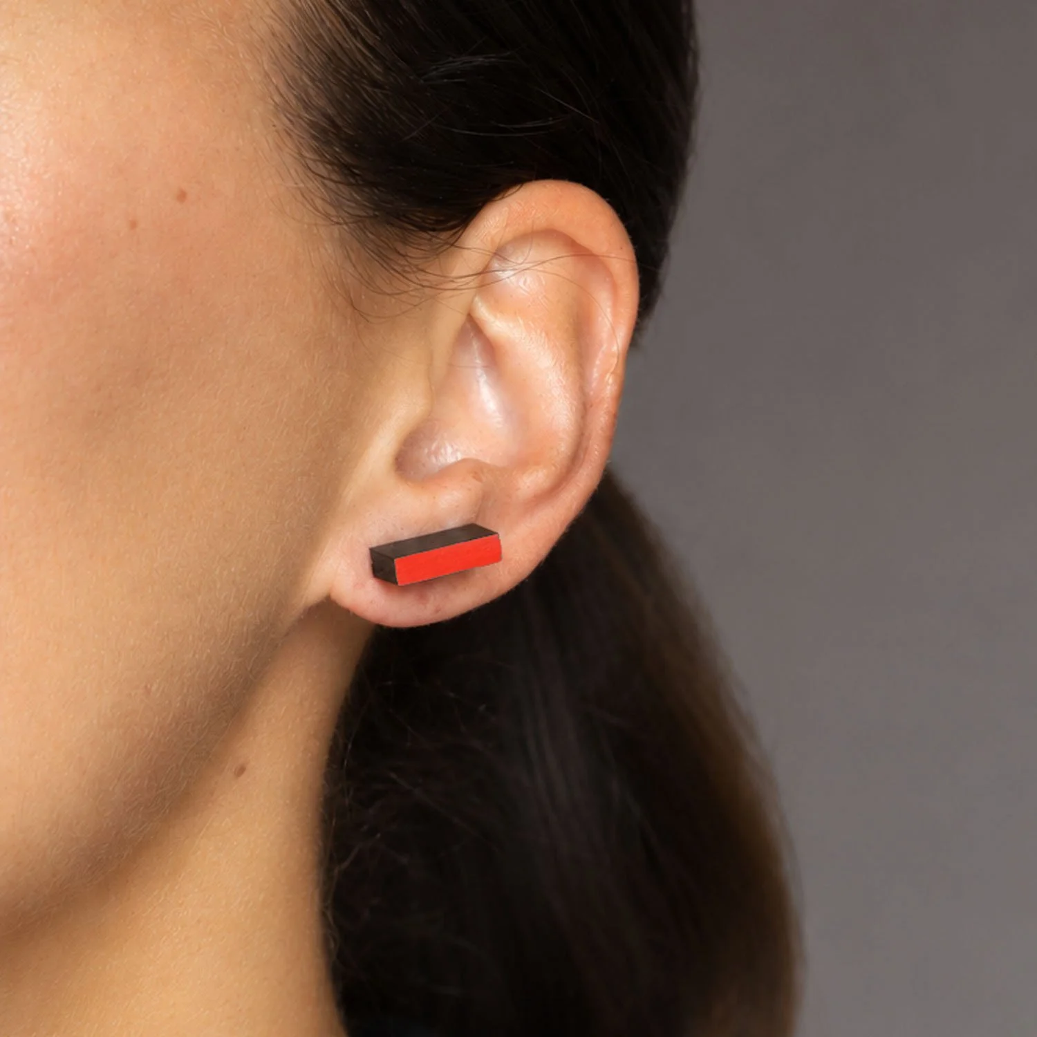 Rectanguar-leather-stud-earrings-black-red-Tania-Clarke-Hall-modelled-detail.jpg
