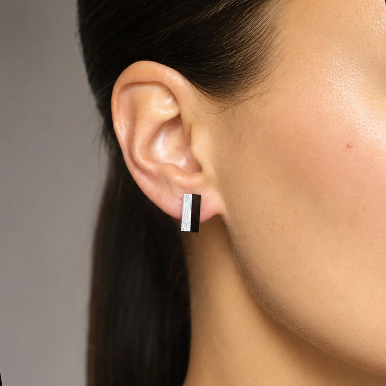 Rectanguar-leather-stud-earrings-black-silver-Tania-Clarke-Hall-modelled-detail.jpg