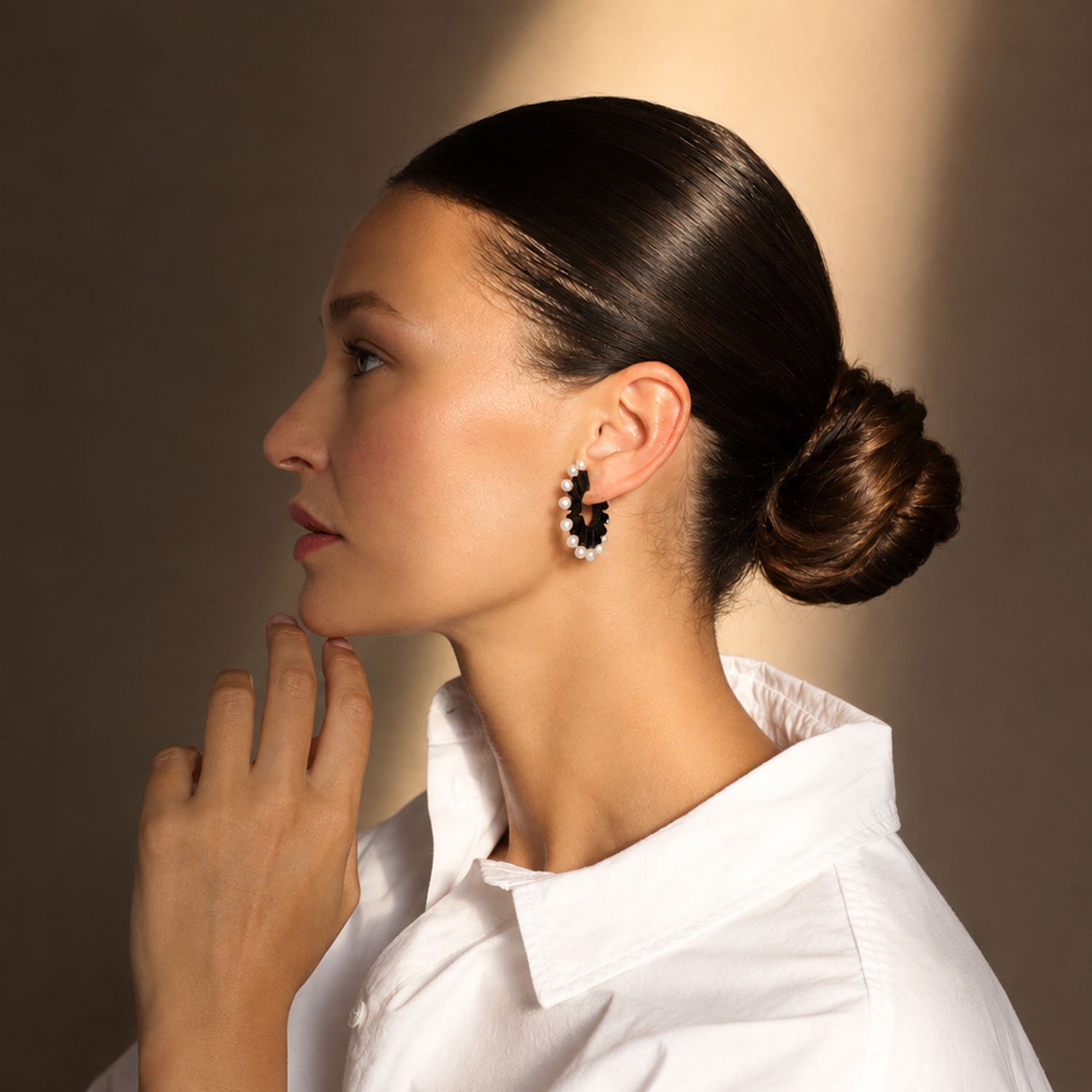 Pearl-loop-leather-statement-earring-black-Tania-Clarke-Hall-modelled-side.jpg