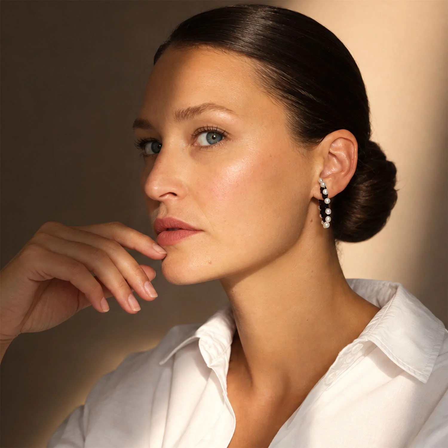 Pearl-loop-leather-statement-earring-black-Tania-Clarke-Hall-modelled-front.jpg