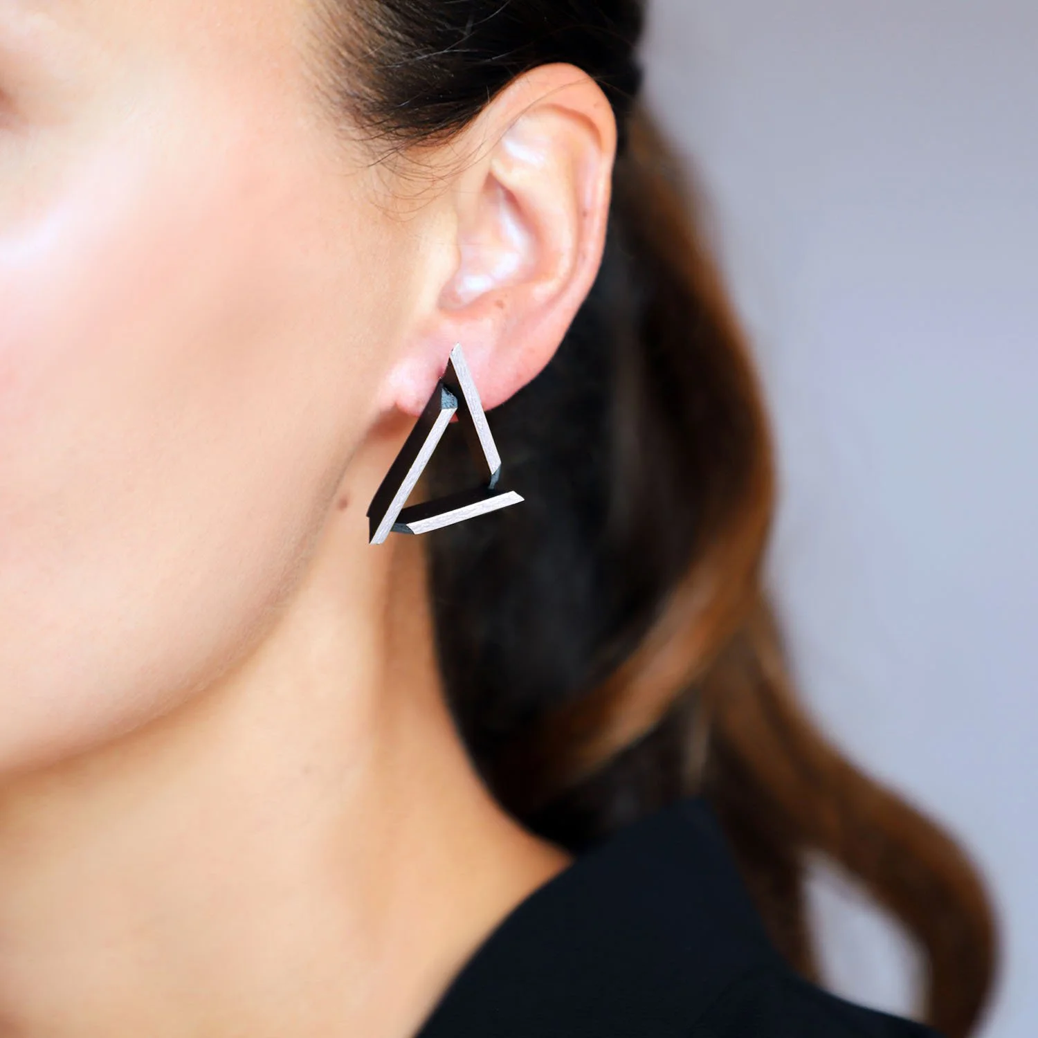 Triangle-leather-earrings-black-silver-Tania-Clarke-Hall-modelled-detail.jpg