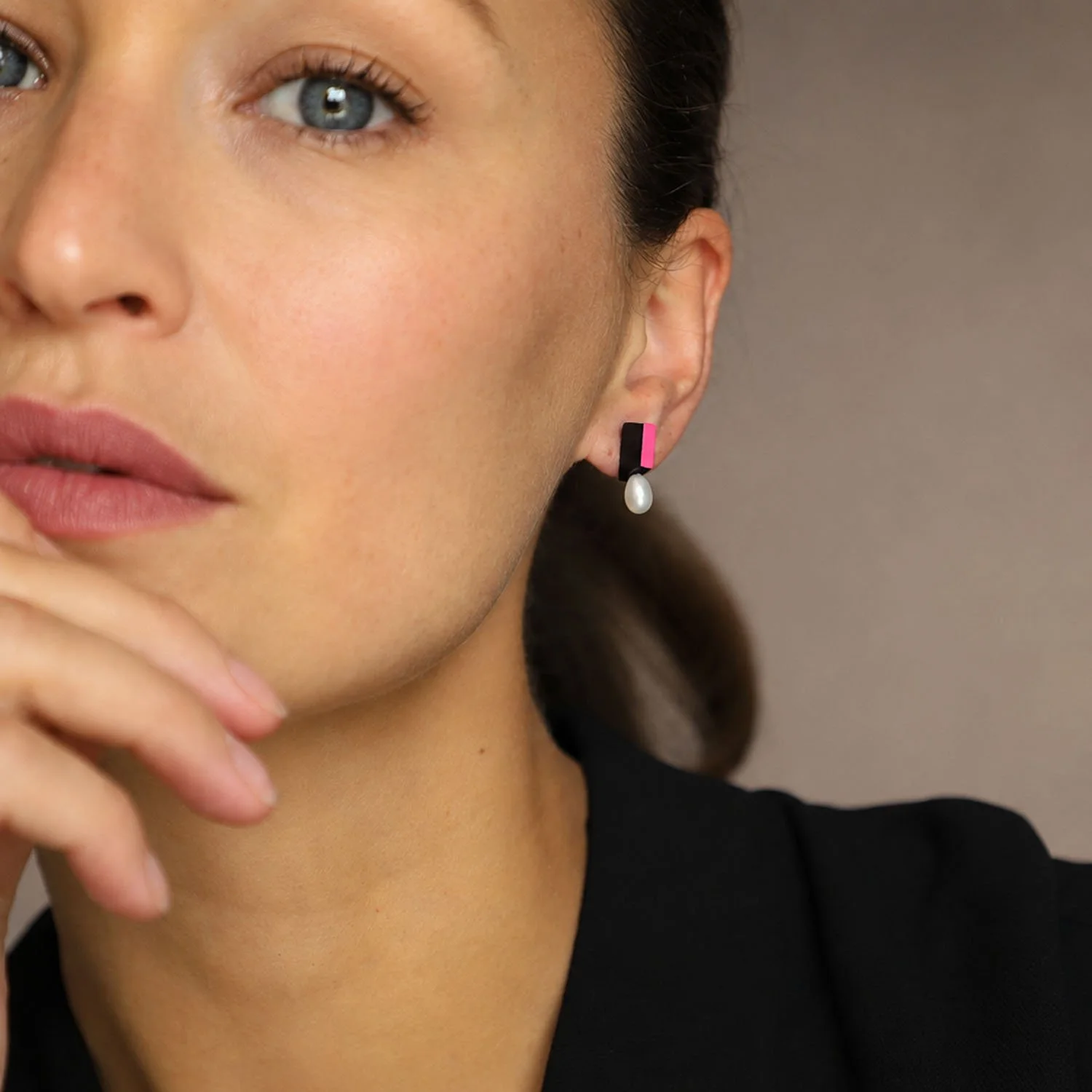 Medal-pearl-leather-stud-earring-black-pink-Tania-Clarke-Hall-modelled.jpg