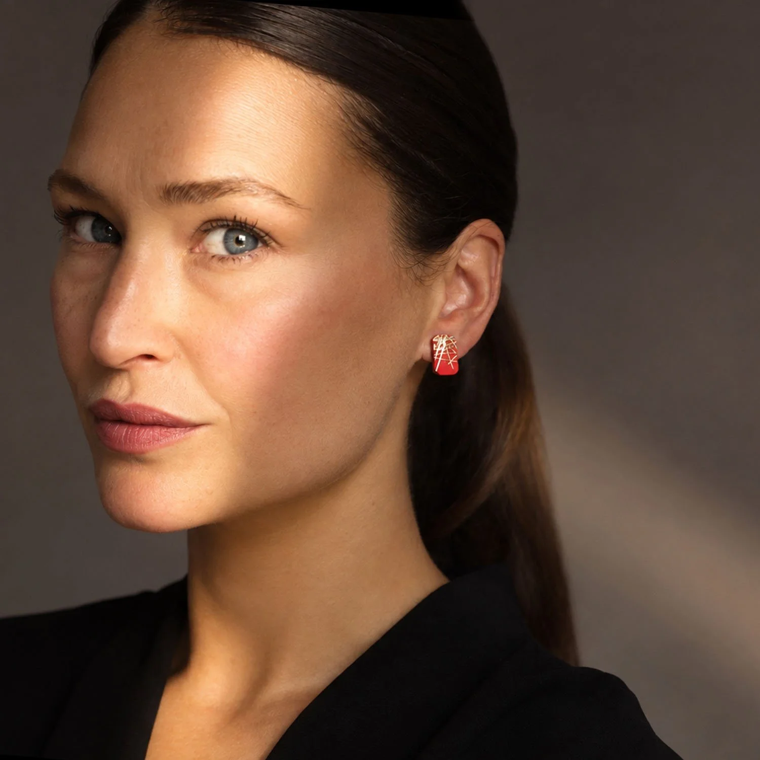 Freehand-rectangular-leather-stud-earrings-red-gold-Tania-Clarke-Hall-modelled.jpg
