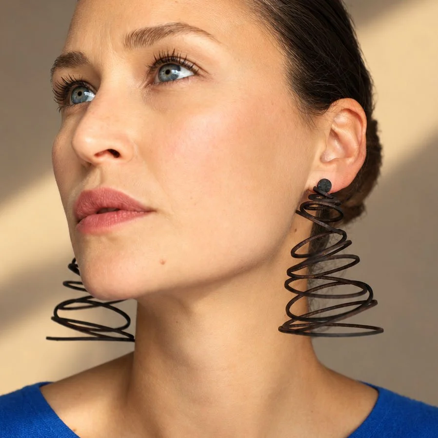 Falling-circles-leather-earrings-statement-black-Tania-Clarke-Hall-modelled-detail.jpg