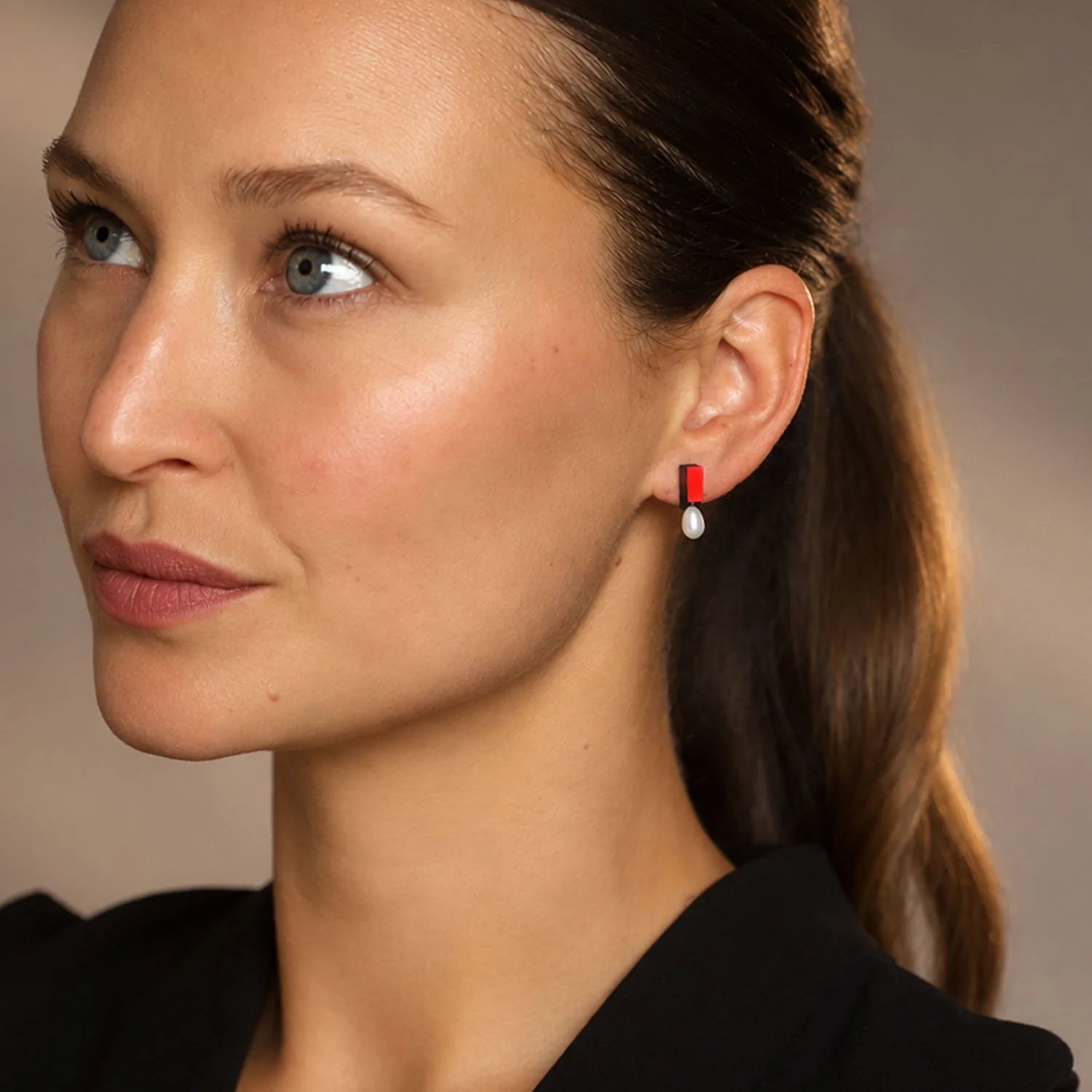 Medal-pearl-leather-stud-earring-black-red-Tania-Clarke-Hall-modelled.jpg