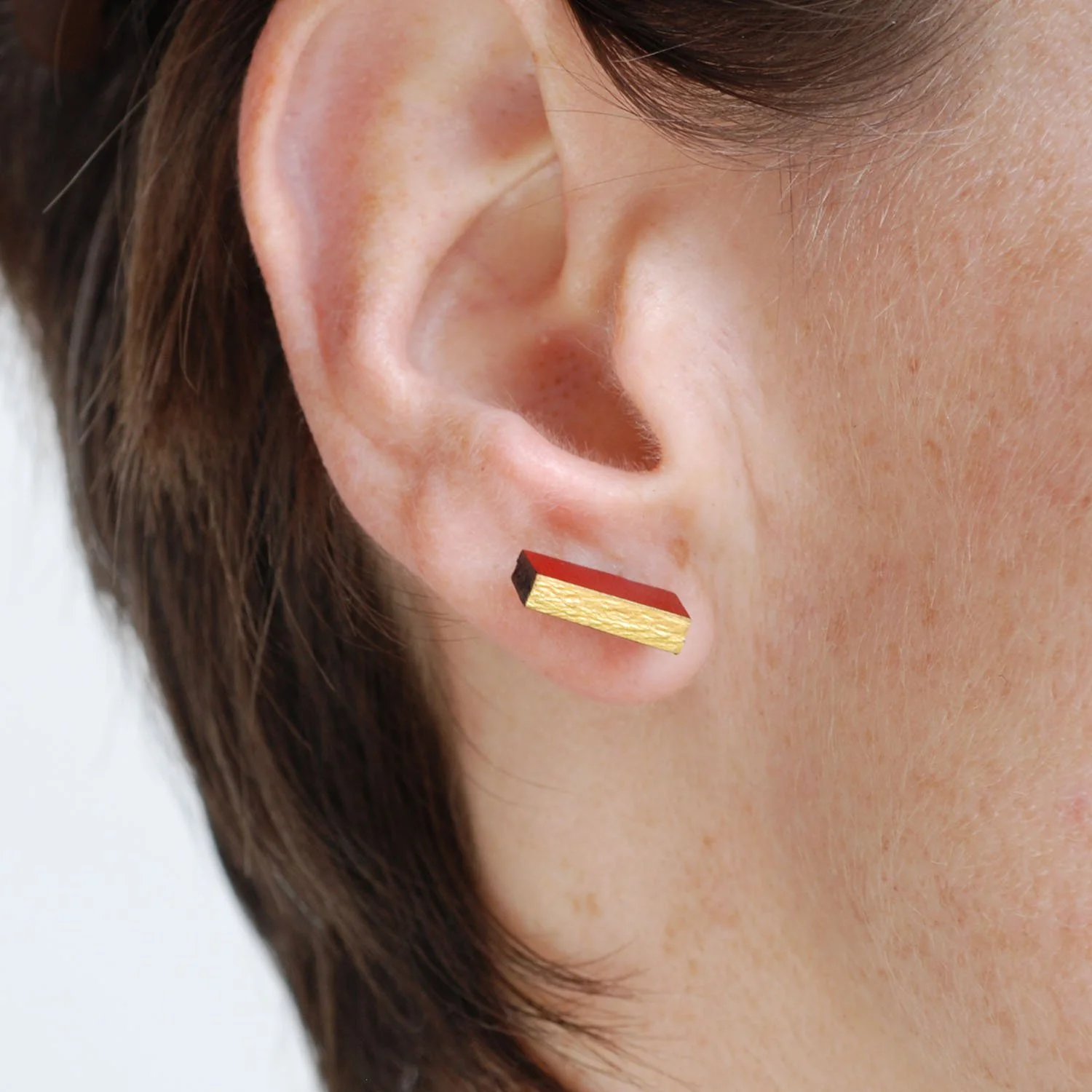 Rectanguar-leather-stud-earrings-doublesided-black-red-gold-Tania-Clarke-Hall-modelled-detail2.jpg
