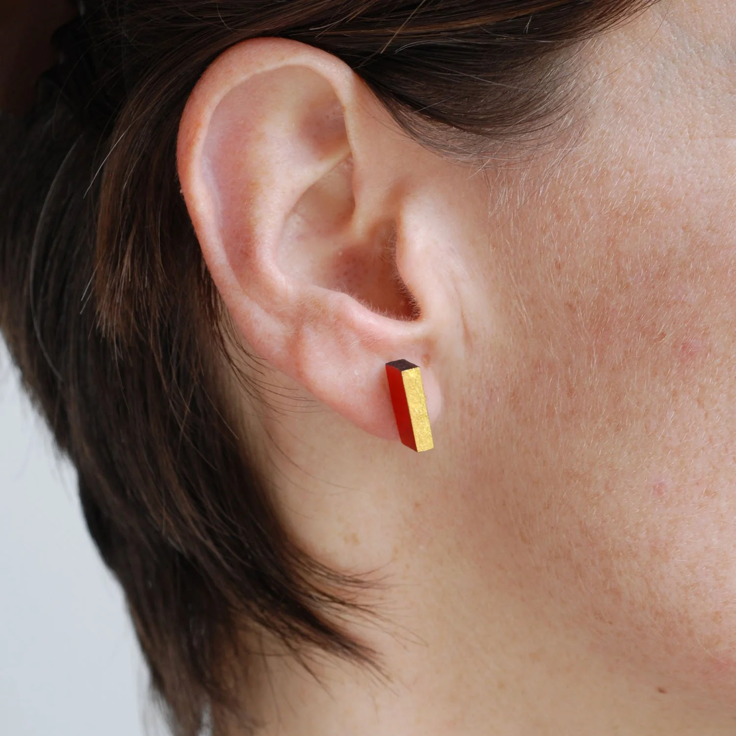Rectanguar-leather-stud-earrings-doublesided-black-red-gold-Tania-Clarke-Hall-modelled-detail3.jpg