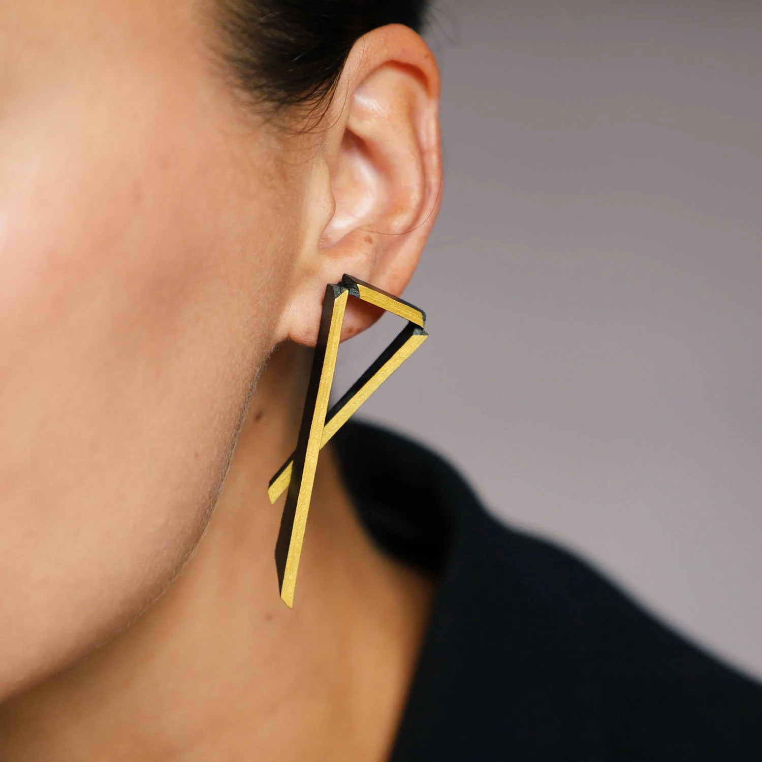 Triangulation-leather-earring-black-gold-Tania-Clarke-Hall-modelled-detail.jpg