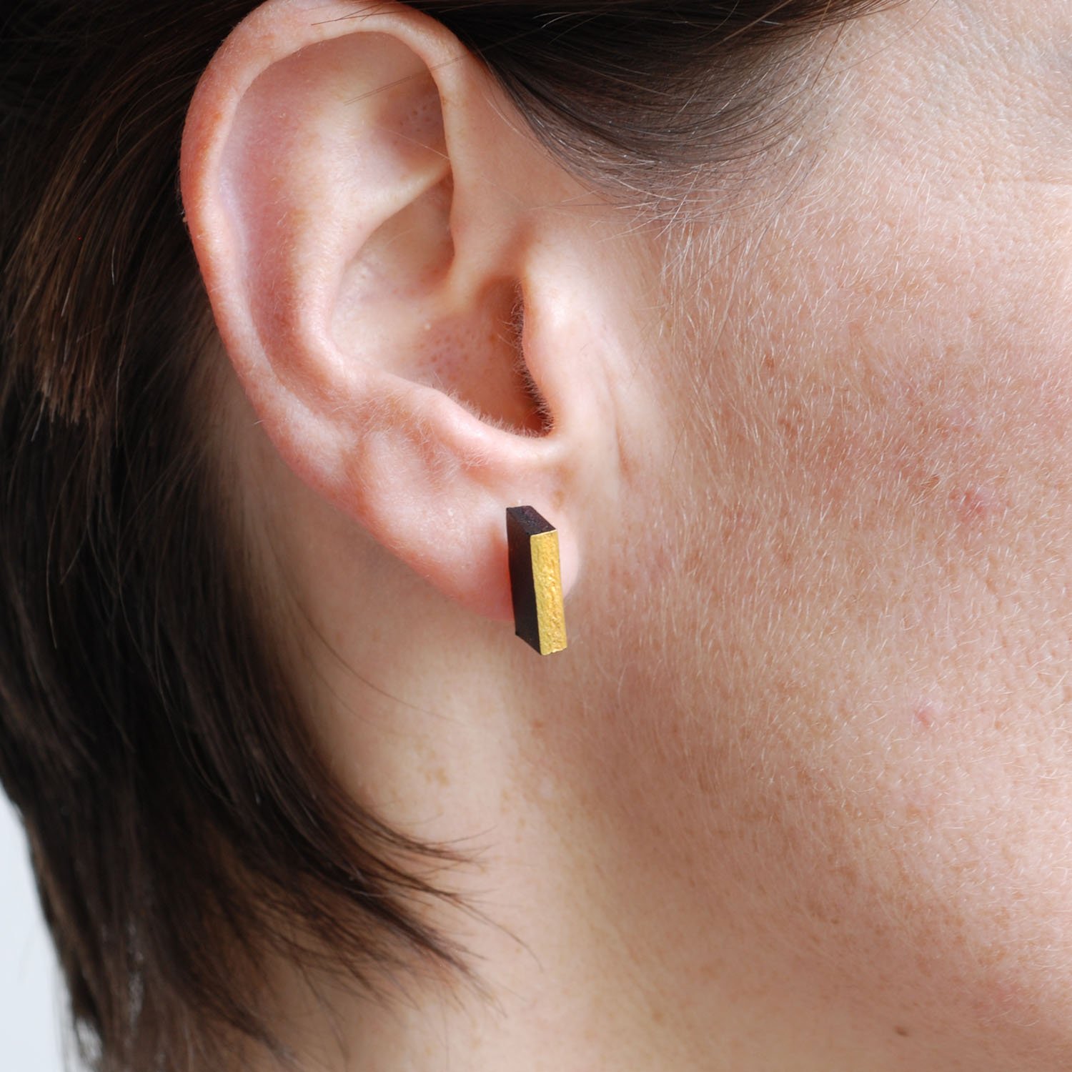 Rectanguar-leather-stud-earrings-doublesided-black-red-gold-Tania-Clarke-Hall-modelled-detail.jpg