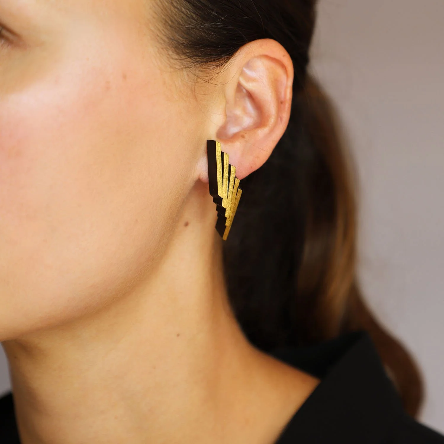 Flight-leather-earrings-black-gold-Tania-Clarke-Hall-angled-detail.jpg