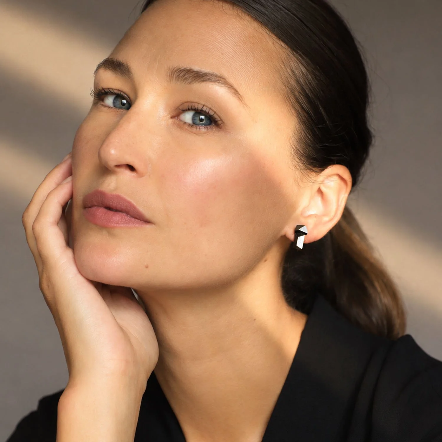Faceted-leather-stud-earrings-black-silver-modelled-Tania-Clarke-Hall.jpg