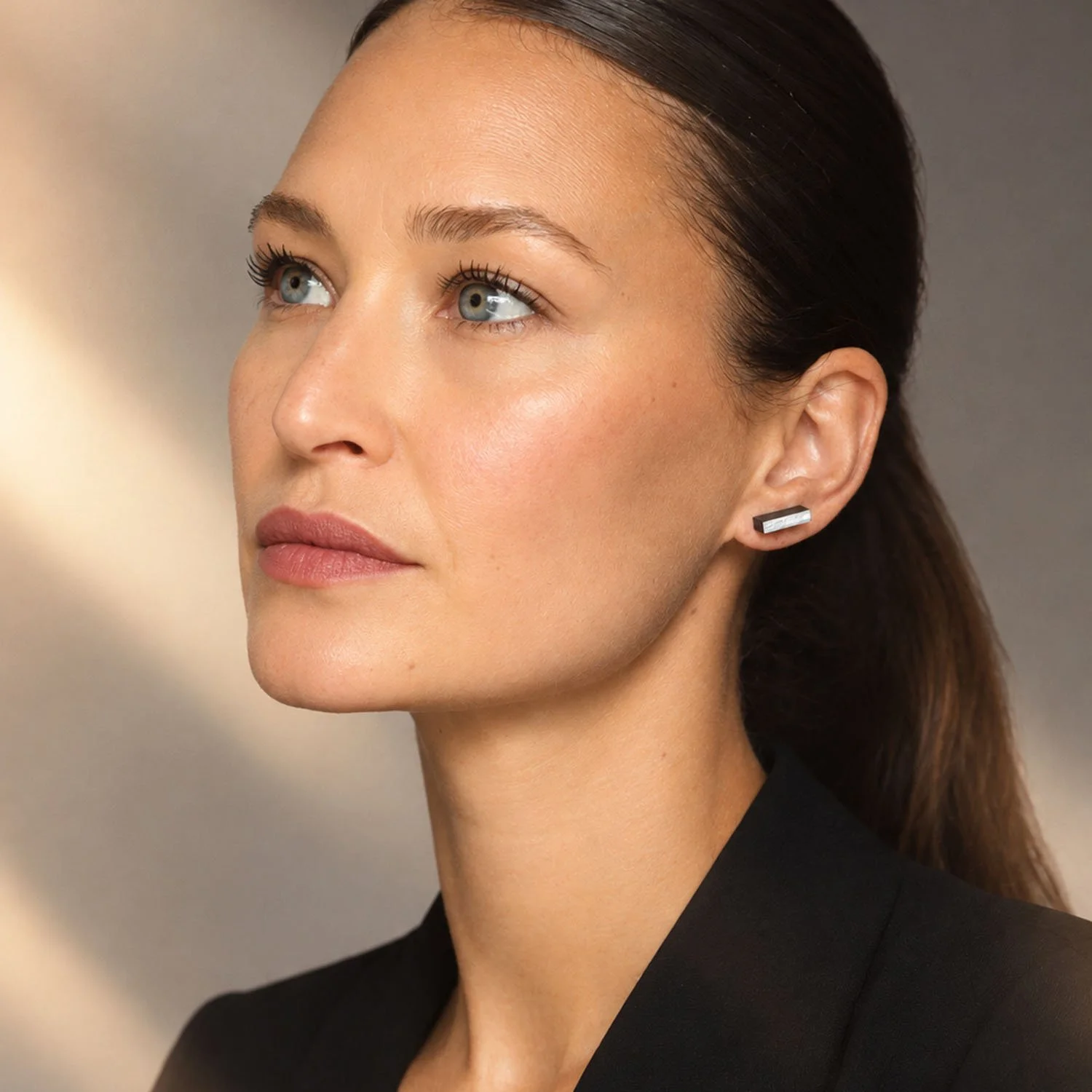 Rectanguar-leather-stud-earrings-black-silver-Tania-Clarke-Hall-modelled.jpg