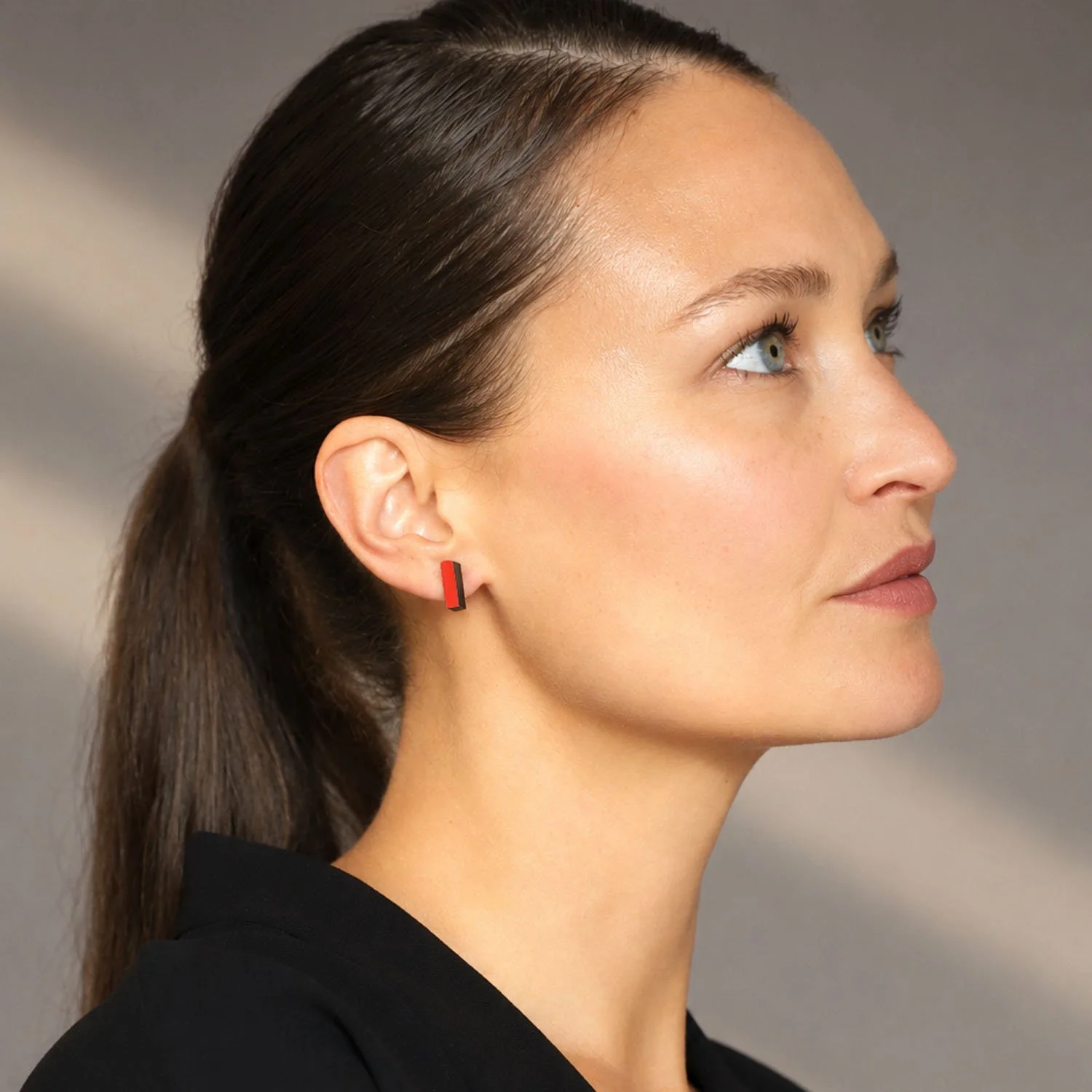 Rectanguar-leather-stud-earrings-black-red-Tania-Clarke-Hall-modelled.jpg