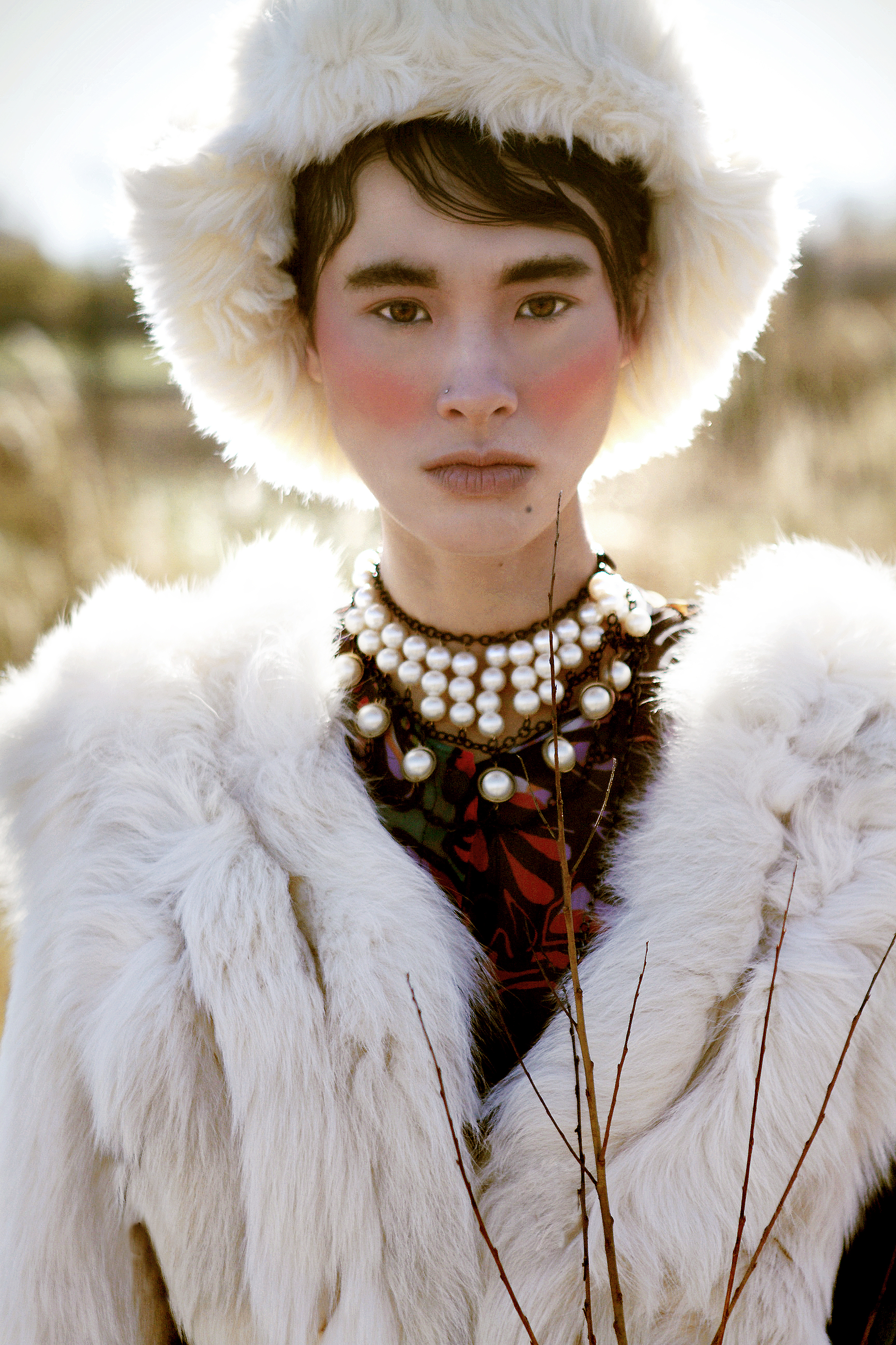 Dress by Carmelita Couture; Fur by Teranchula Couture; Fur Hat by Ke Collection