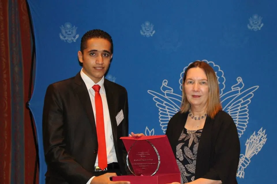 Ahmed receives an award by the US Embassy in Cairo