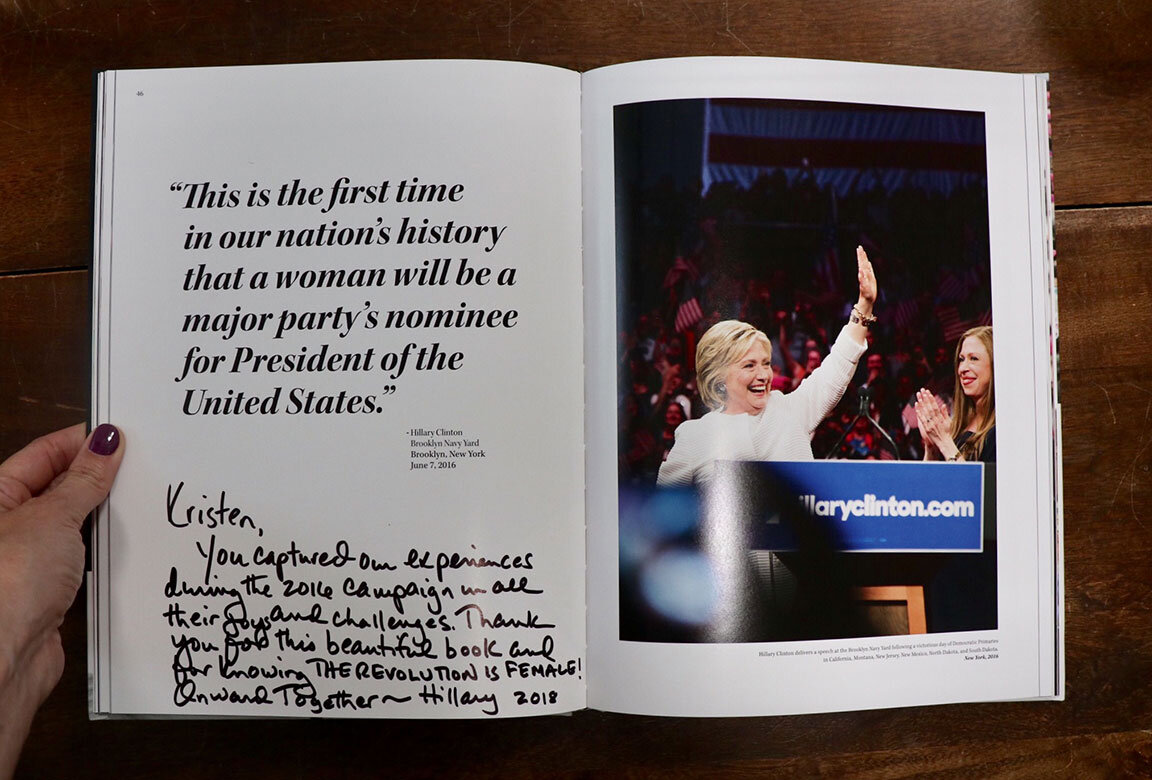  Secretary Hillary Clinton inks a message into Blush’s personal copy of The Revolution Is Female, New York, NY 2018 