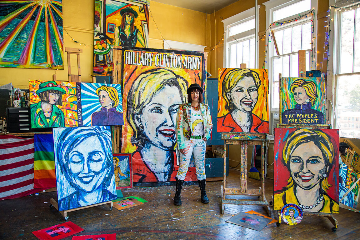  Artist and Activist Gretchen Baer poses with her portrait collection of Hillary Clinton. Bisbee, AZ, 2018 
