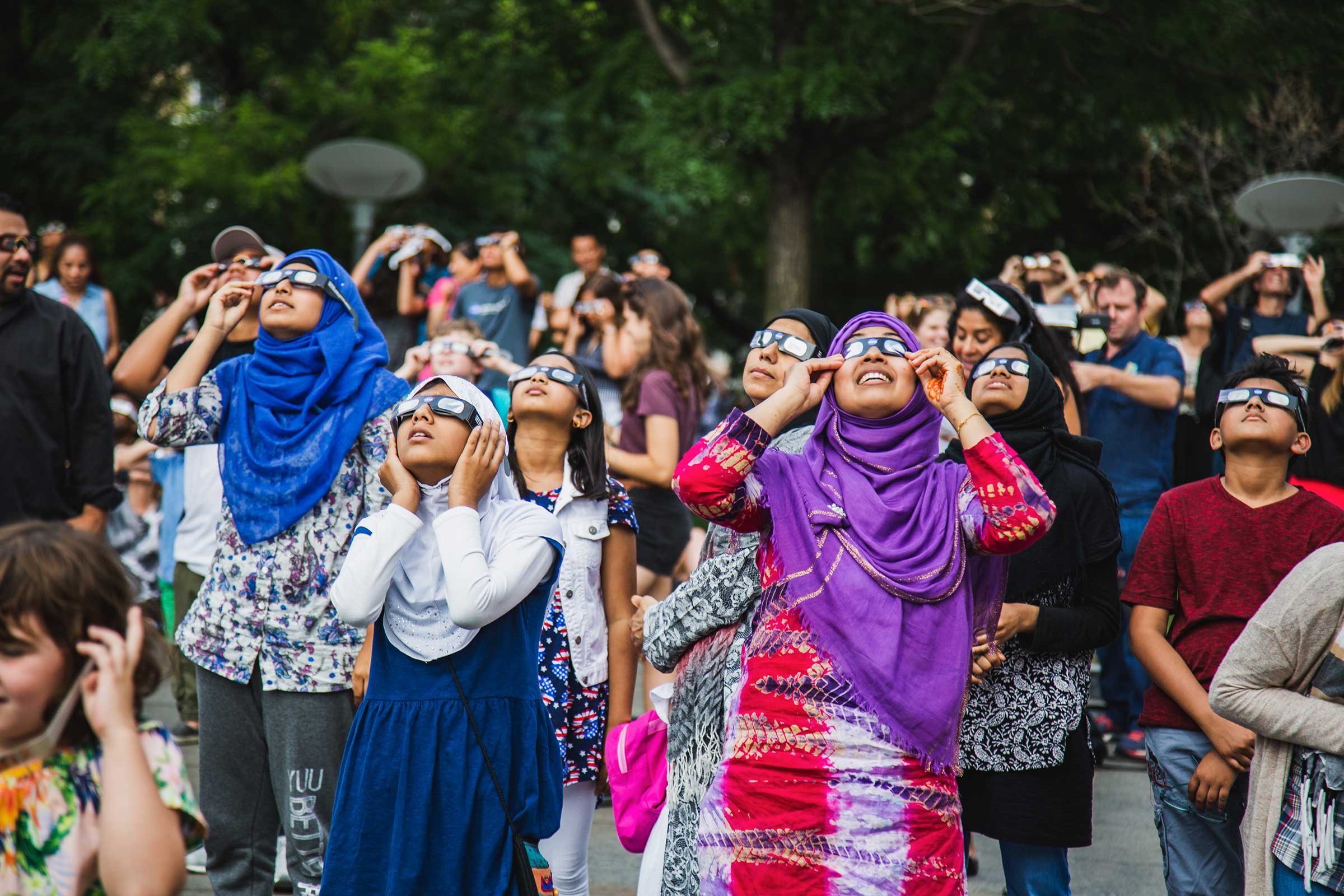  New Yorkers gather at the Museum of Natural History to view the solar eclipse, New York, NY 