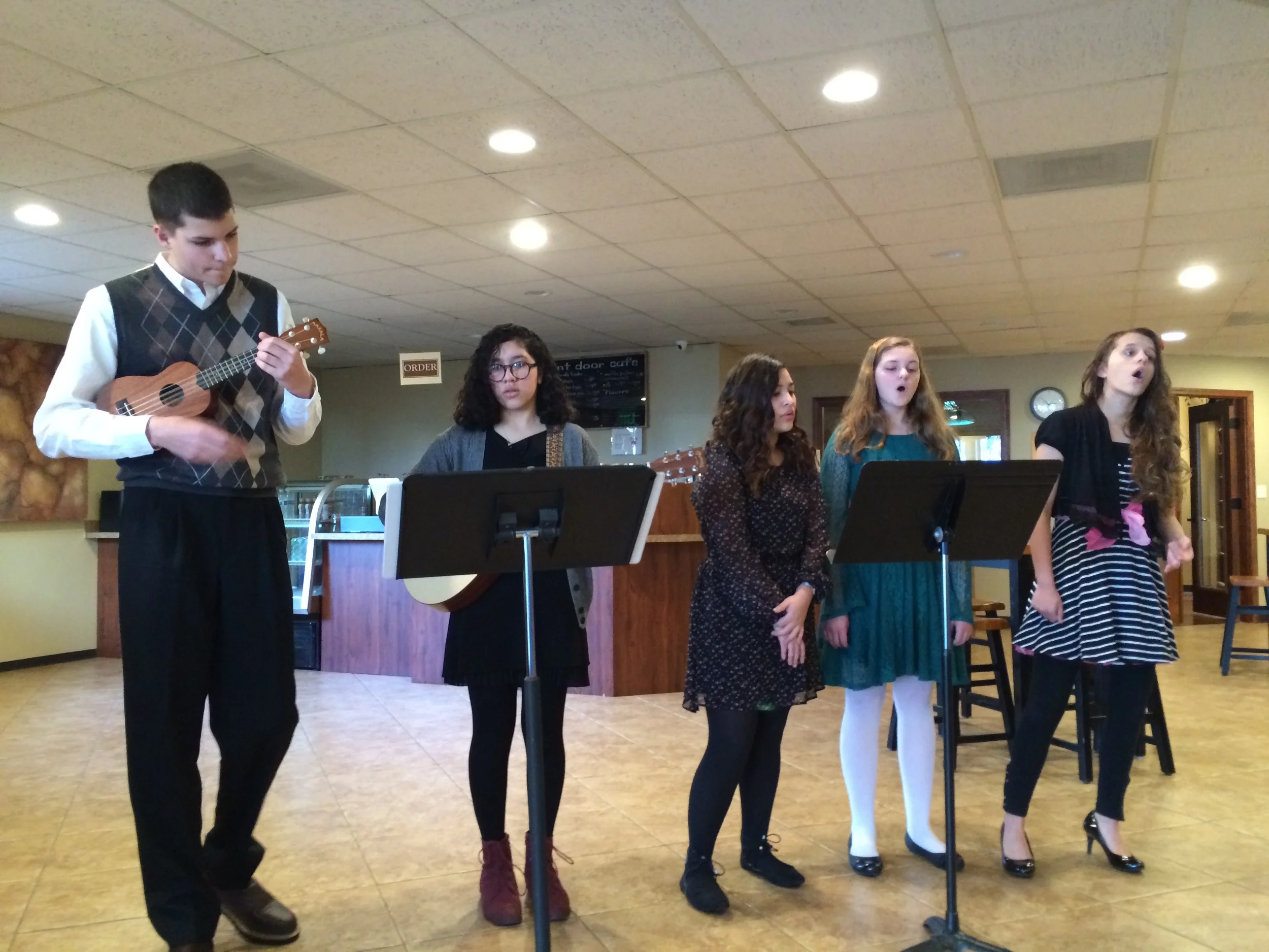 Voice Students sing carols before Christmas Eve Services at Bethel Chehalis.