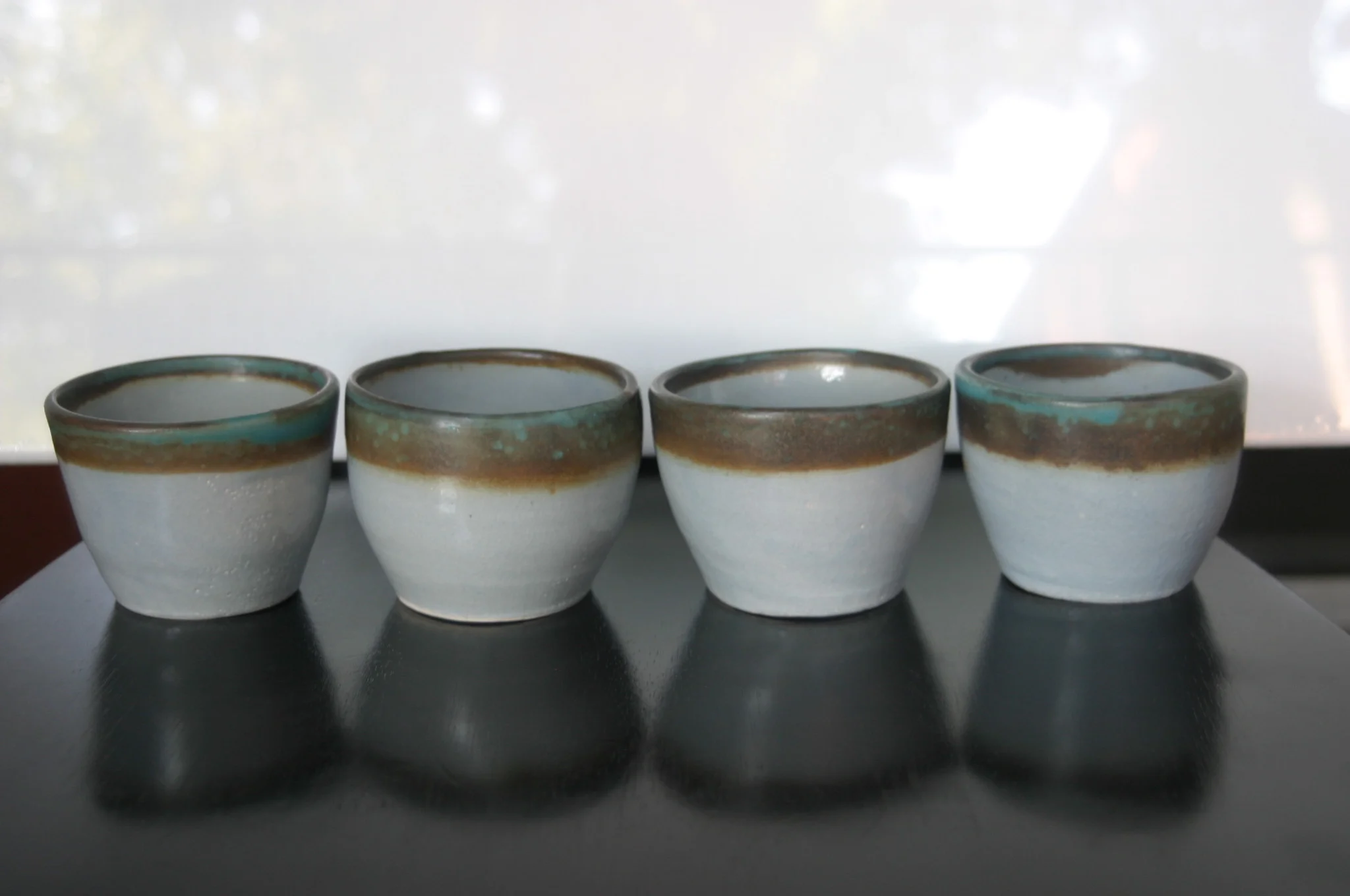  Rainier Teacups, 2013, glazed stoneware, approximately 3”x3”x3” each 