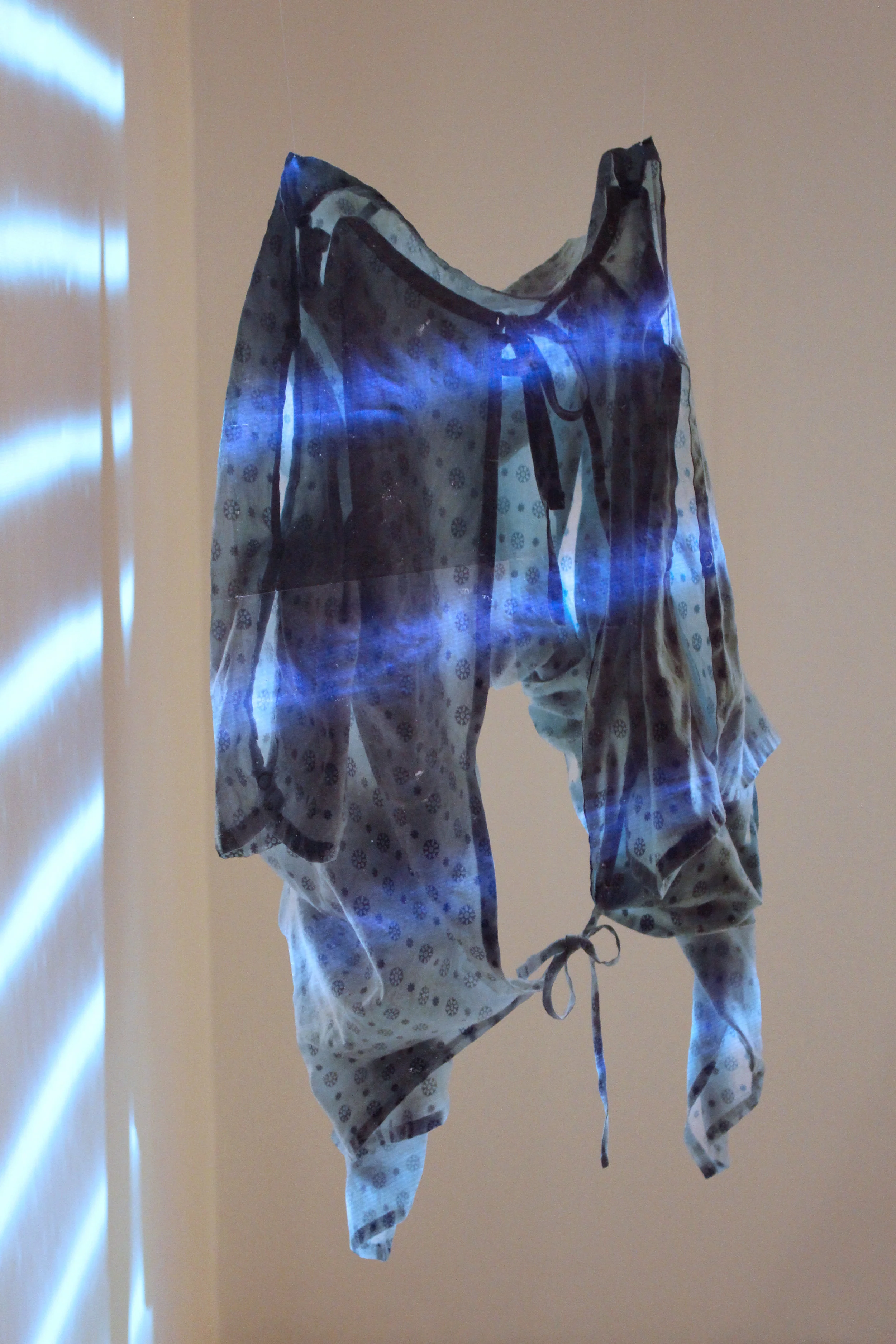 "MRI IN USE" Installation, Encaustic transfer on silk and projection, 45" x 30" each, 2015. Art Gallery of St. Albert