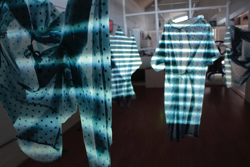 "MRI IN USE" Installation, Encaustic transfer on silk and projection, 45" x 30" each, 2015. Alberta Printmakers Main Gallery
