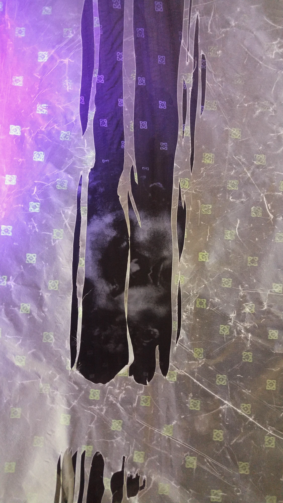 "“Healing House III,” (Detail) Beeswax, silk, silkscreen, black light, 60” x 75” x 25,” 2018