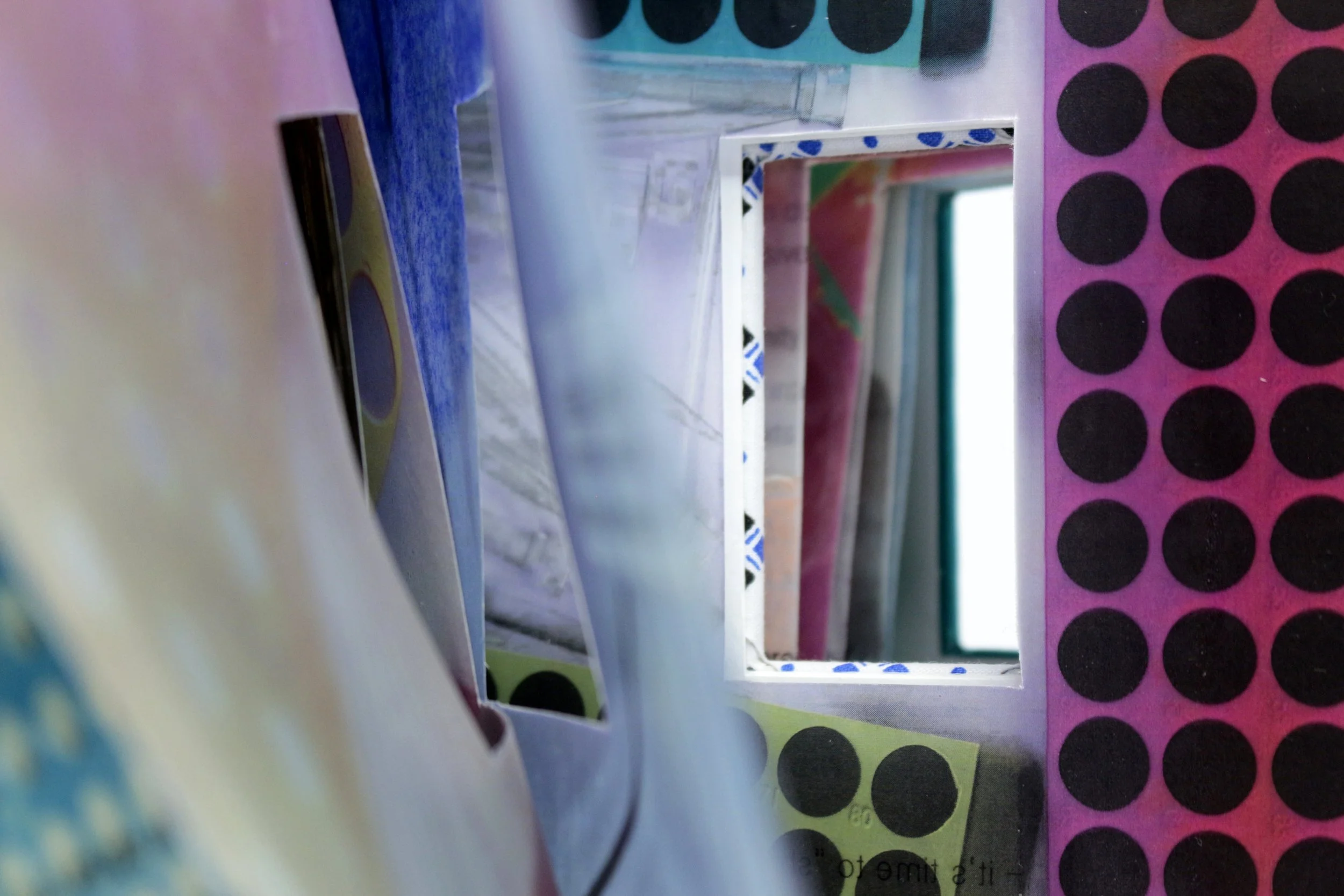Medical // Humanities Volumes I & II , Artist’s Book, encaustic transfer on silk, hospital gown, and scrubs, 11.5” x 7,” 2024. Text by Suze Berkout, Sarah de Leeuw, and Darian Goldin Stahl.