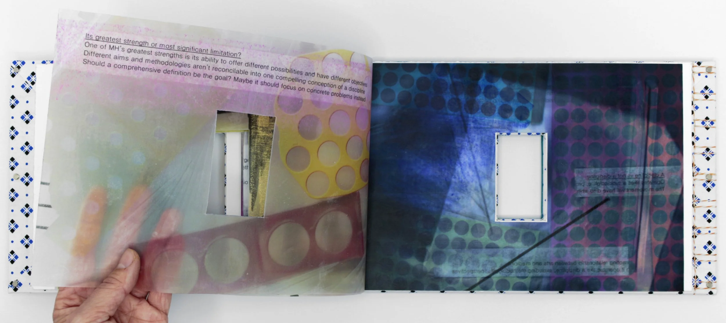 Medical // Humanities Volumes I & II , Artist’s Book, encaustic transfer on silk, hospital gown, and scrubs, 11.5” x 7,” 2024. Text by Suze Berkout, Sarah de Leeuw, and Darian Goldin Stahl.