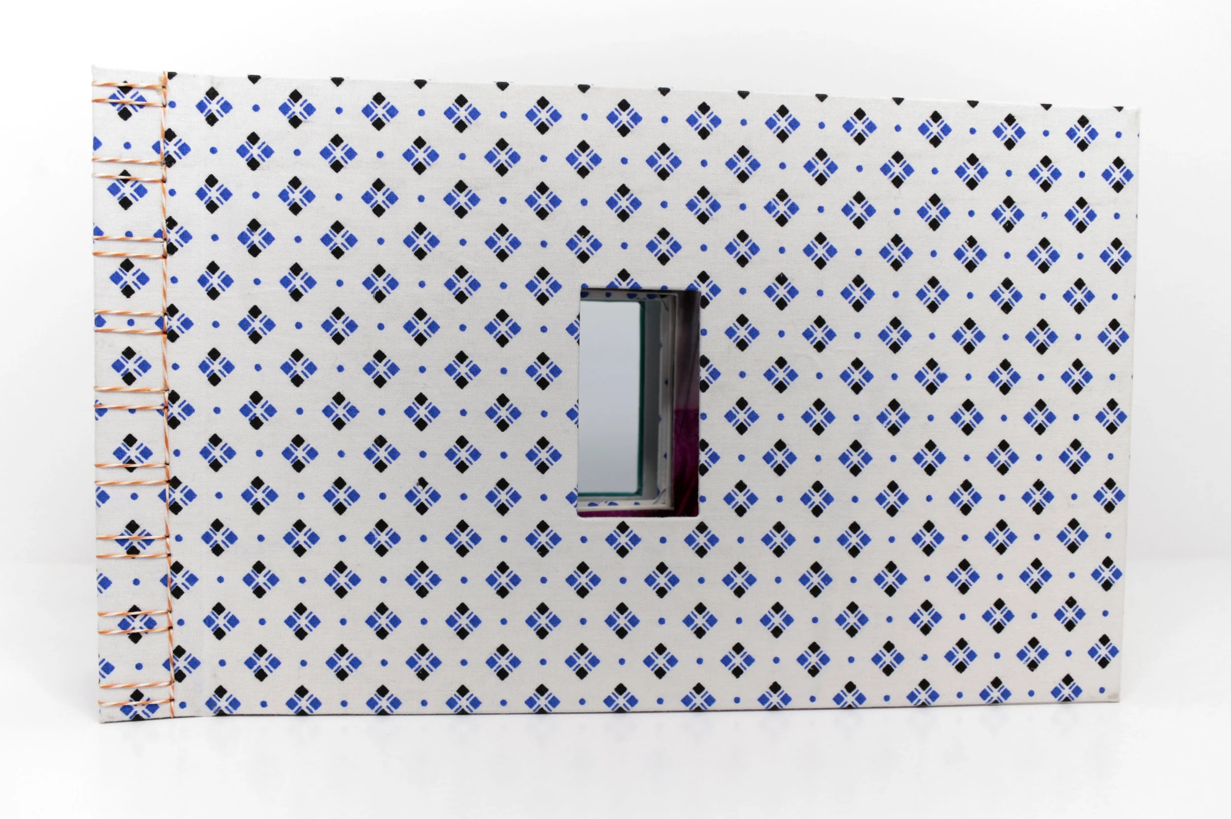 Medical // Humanities Volumes I & II , Artist’s Book, encaustic transfer on silk, hospital gown, and scrubs, 11.5” x 7,” 2024. Text by Suze Berkout, Sarah de Leeuw, and Darian Goldin Stahl.