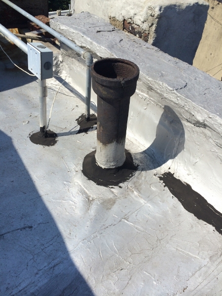 Examples of flashing and tarred seams on the roof.